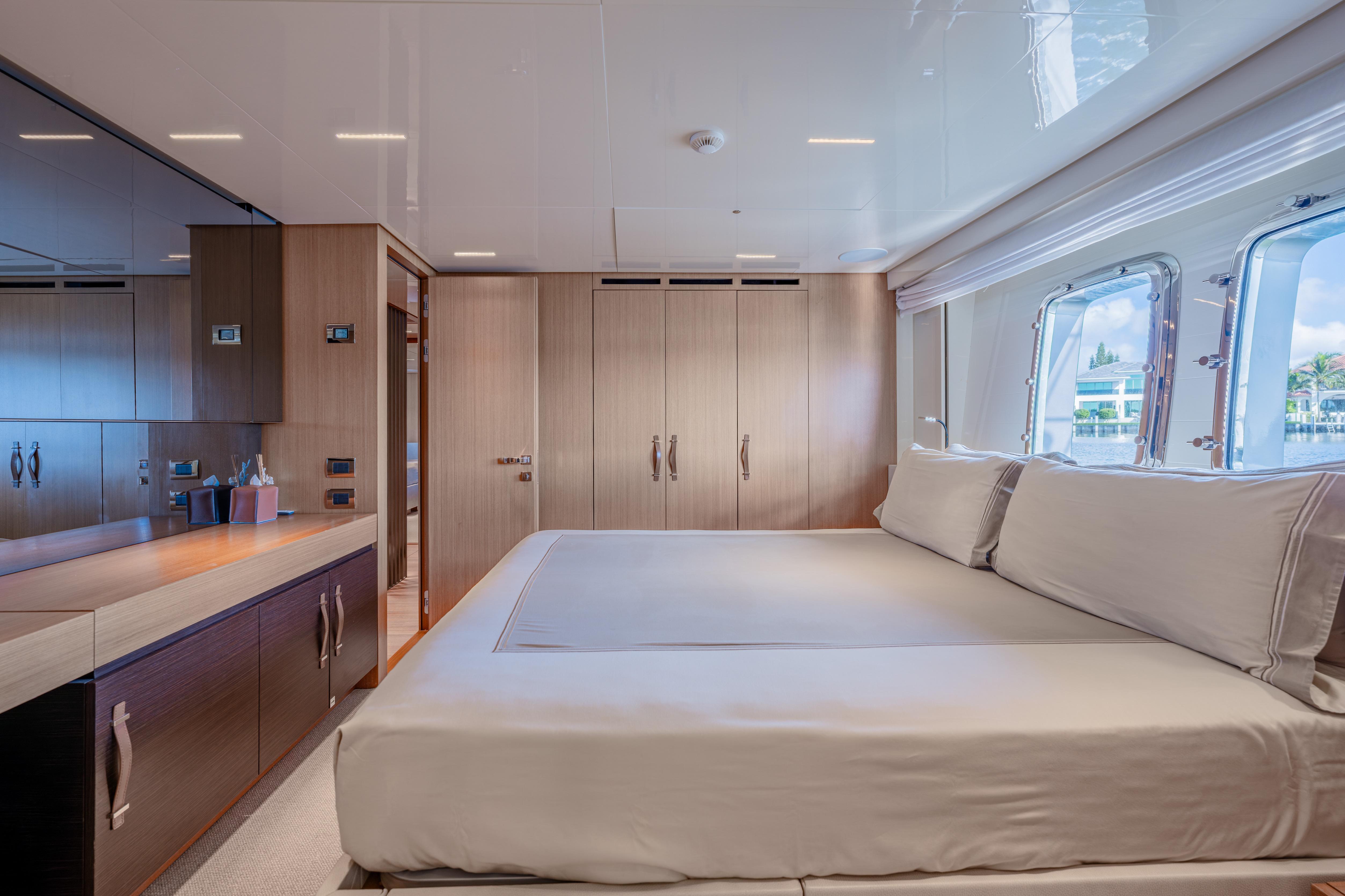 Luxurious bedroom interior of 2023 Sanlorenzo SL120A yacht with modern design and large windows.