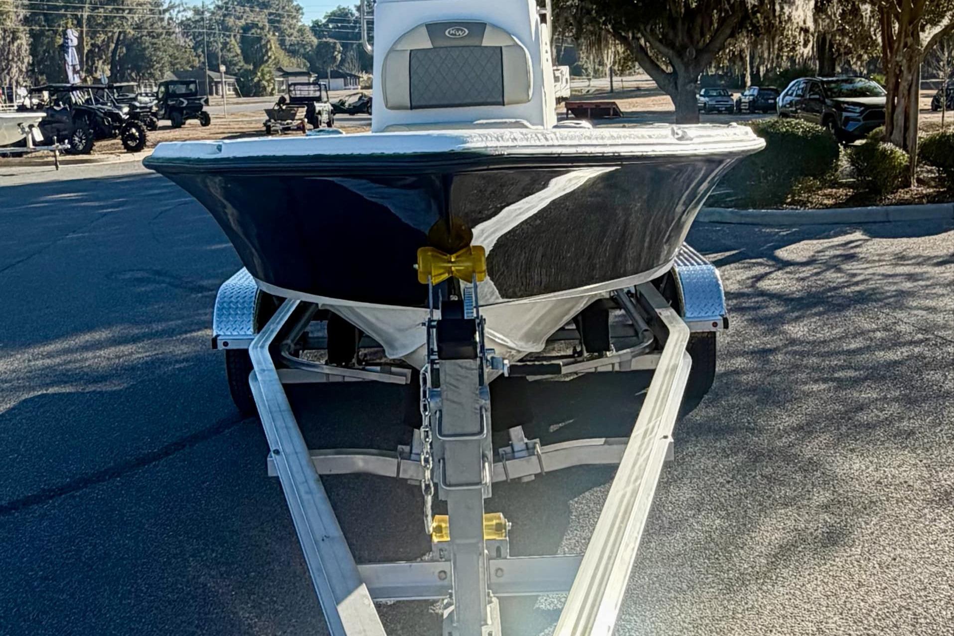2026 Key West 210 Bay Reef boat on trailer, parked outdoors.