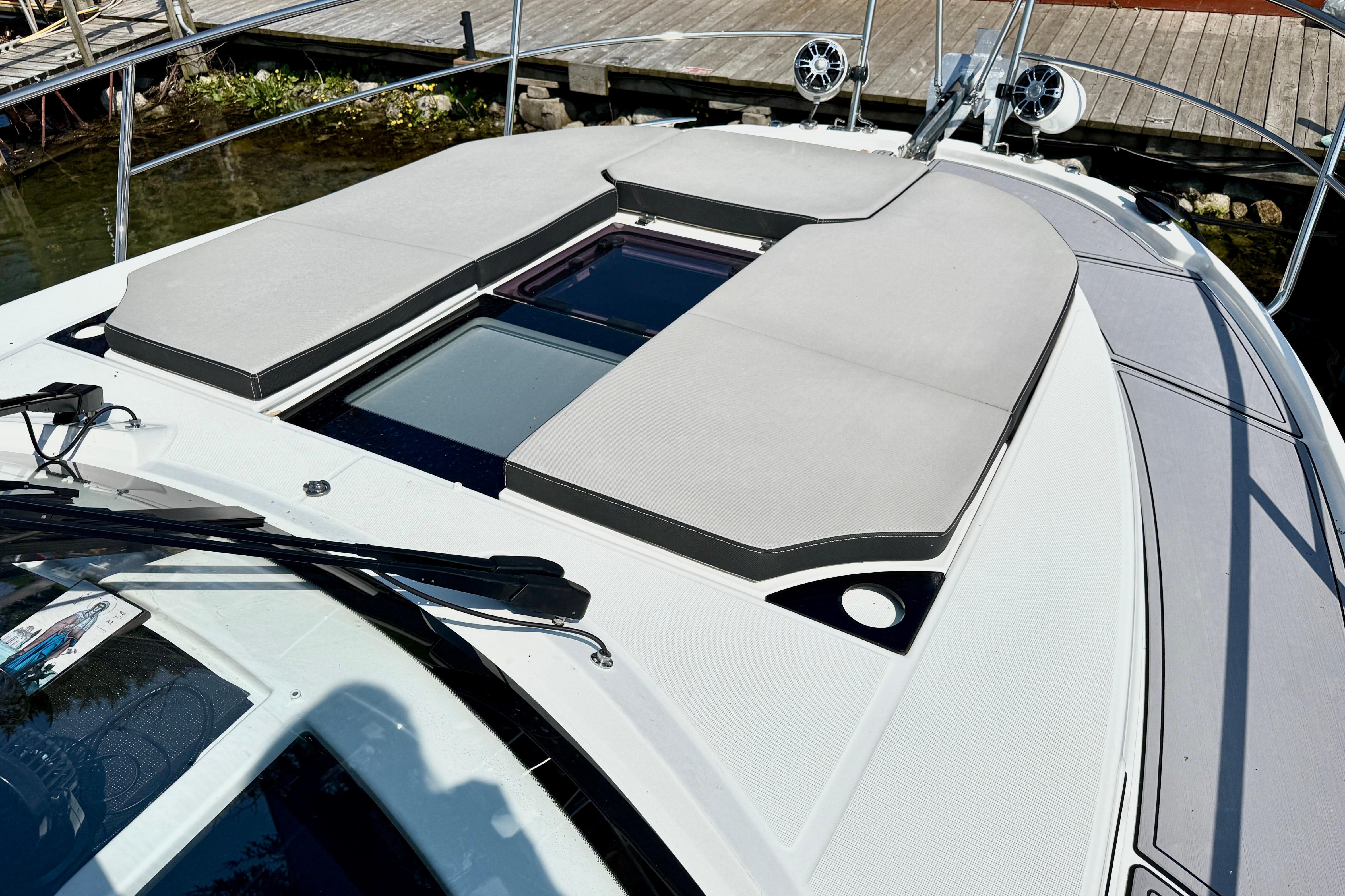 2022 Jeanneau NC 1095 Fly boat with cushioned deck and sleek design.