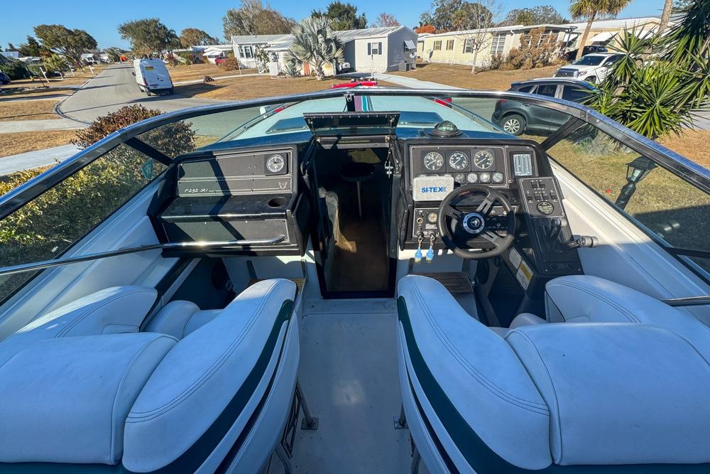 1989 Formula 292 SR-1 boat cockpit with steering wheel and dashboard controls.