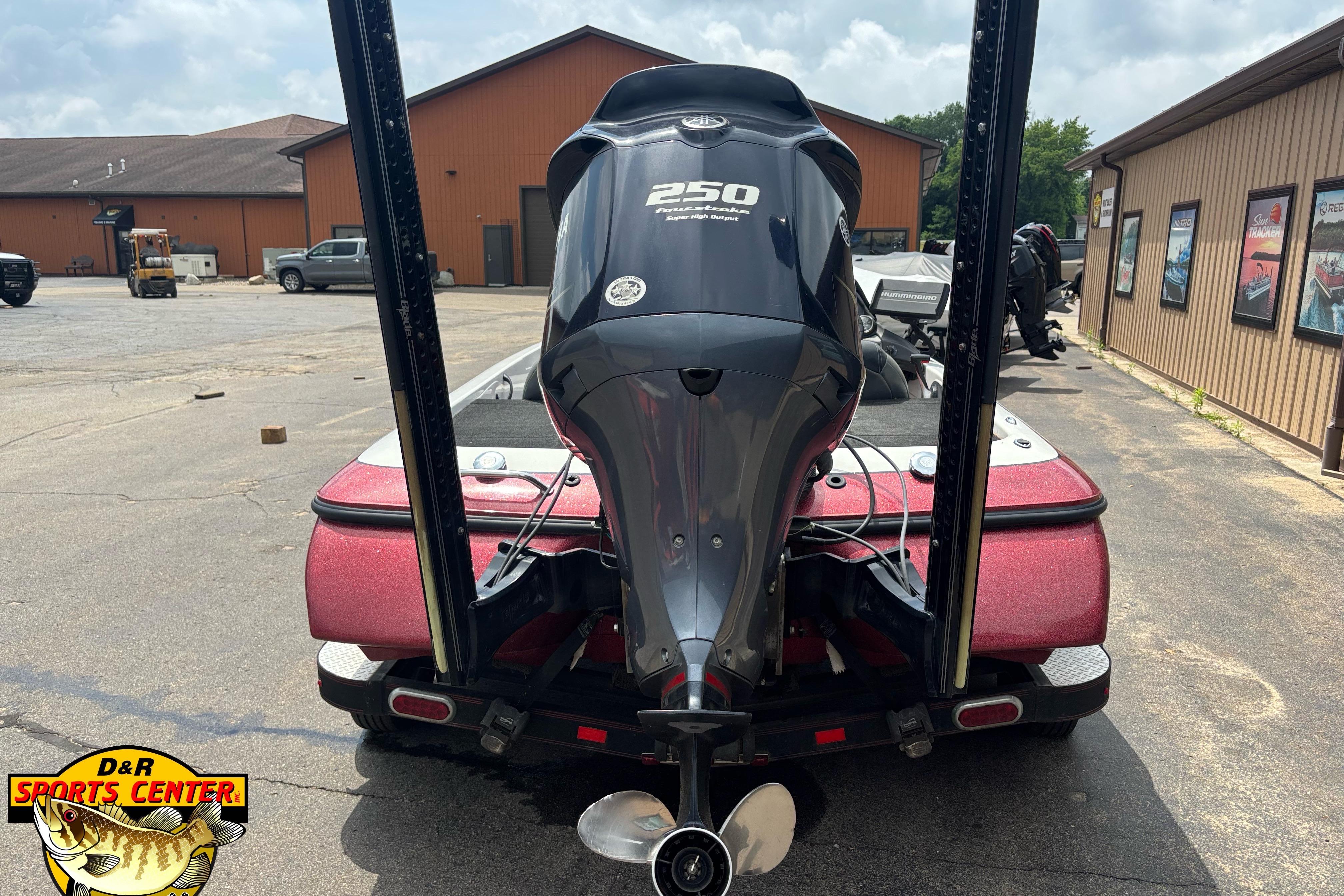2013 Skeeter ZX20 boat with powerful 250 horsepower engine, parked outdoors.