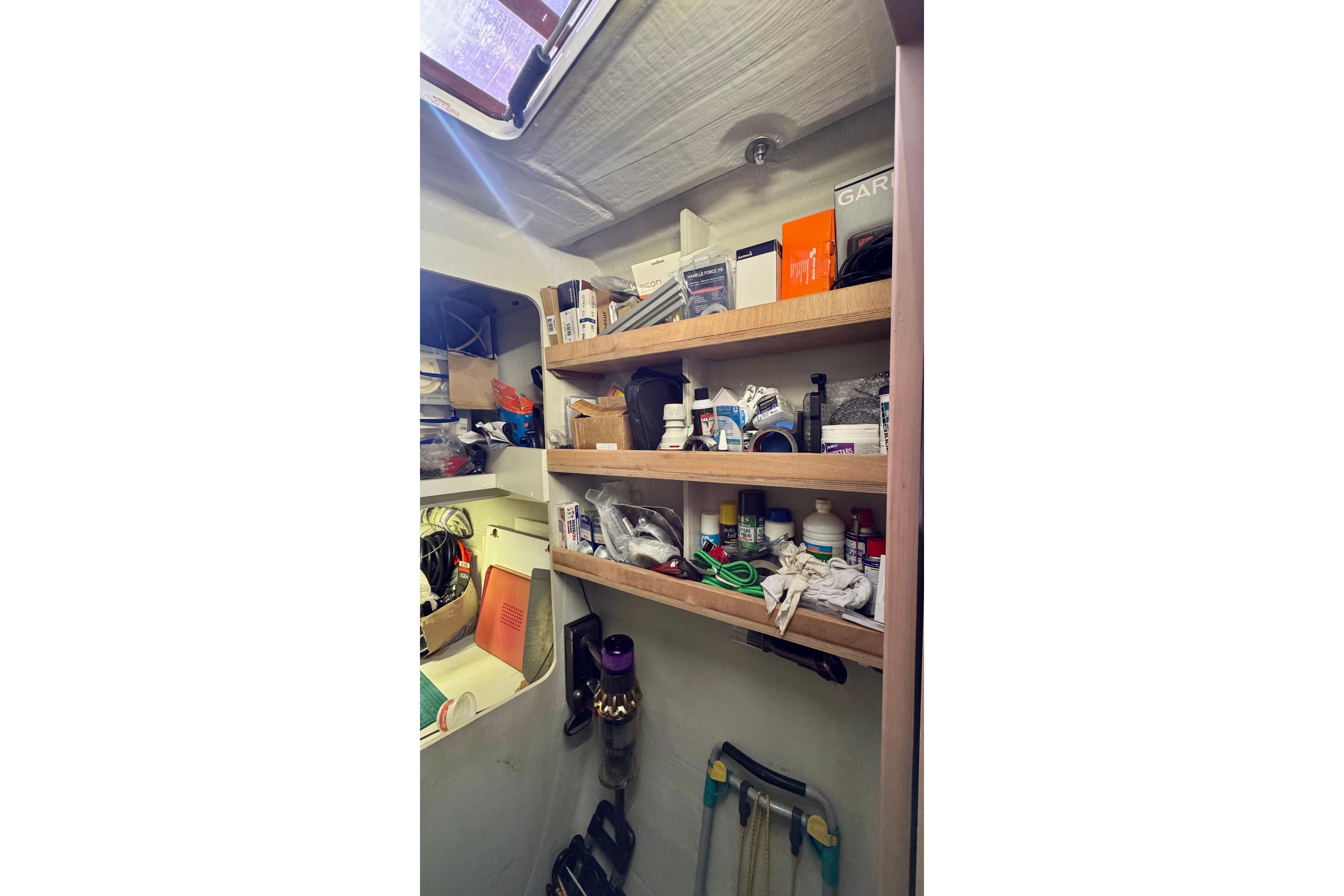Storage shelves with various supplies on a 2020 Fountaine Pajot Saona 47 catamaran.