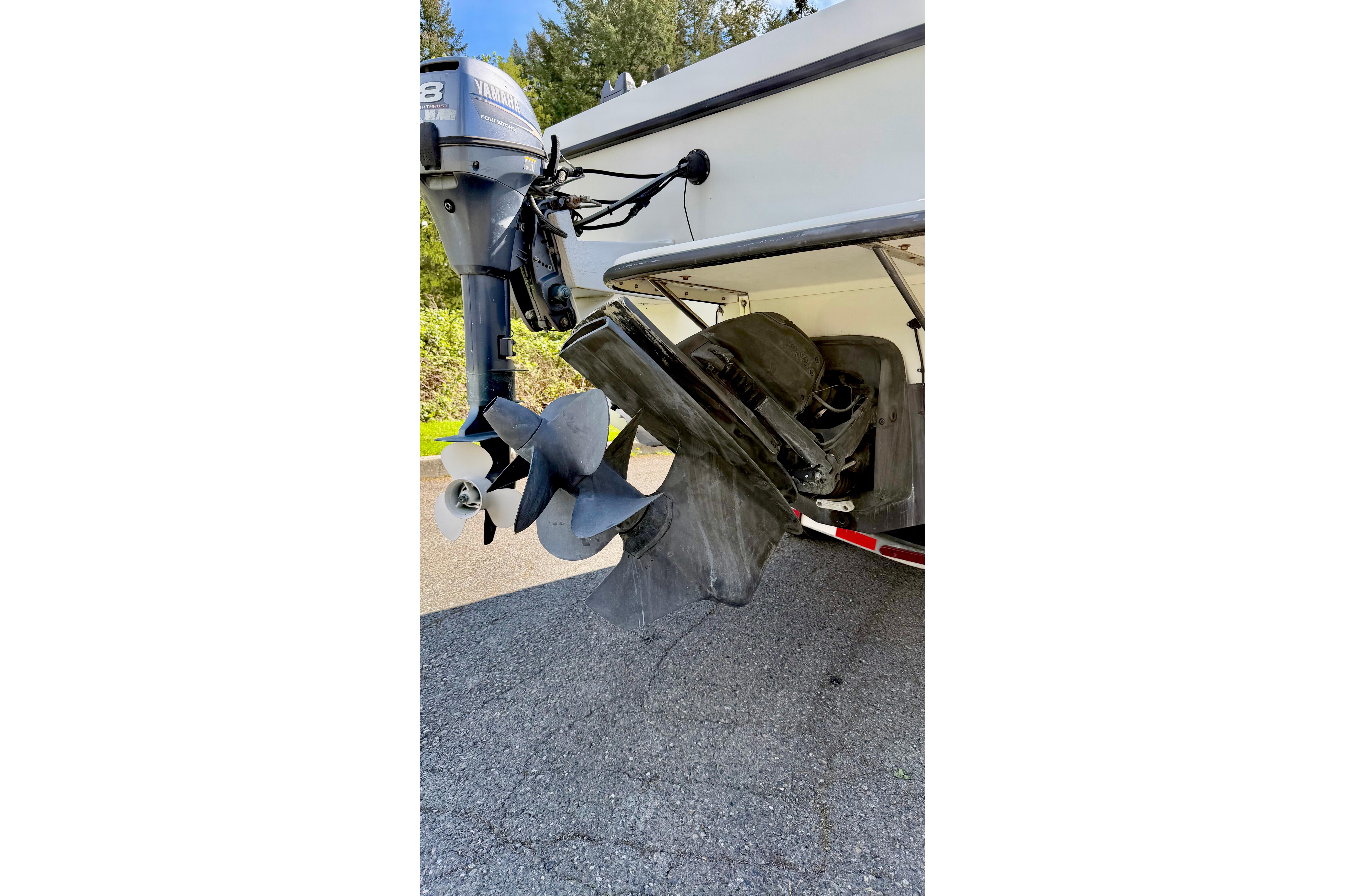 Rear view of a 2006 Osprey Legend boat with Yamaha outboard motor and propeller.