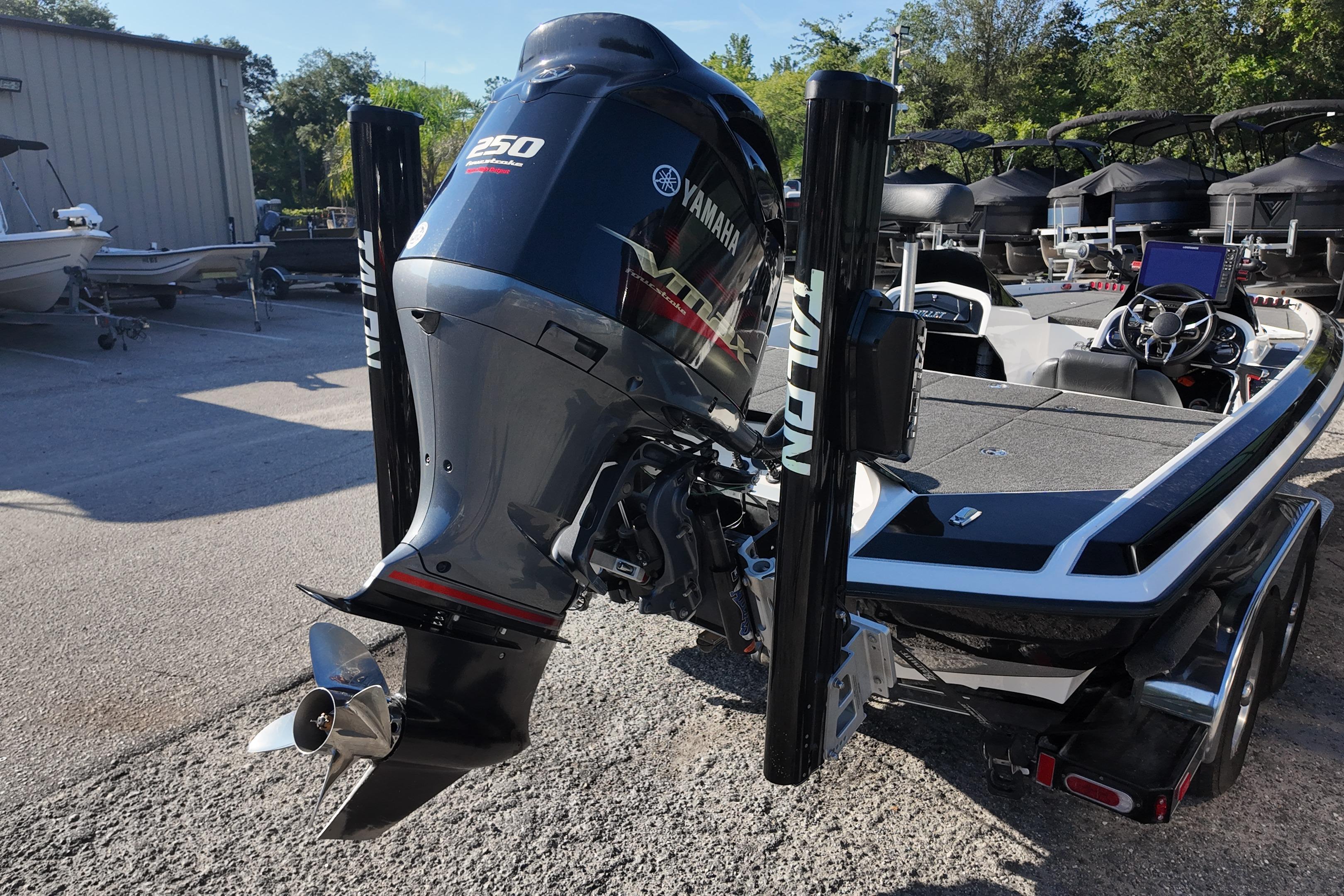 2022 Bullet 21SDC boat with Yamaha 250 engine, parked outdoors.