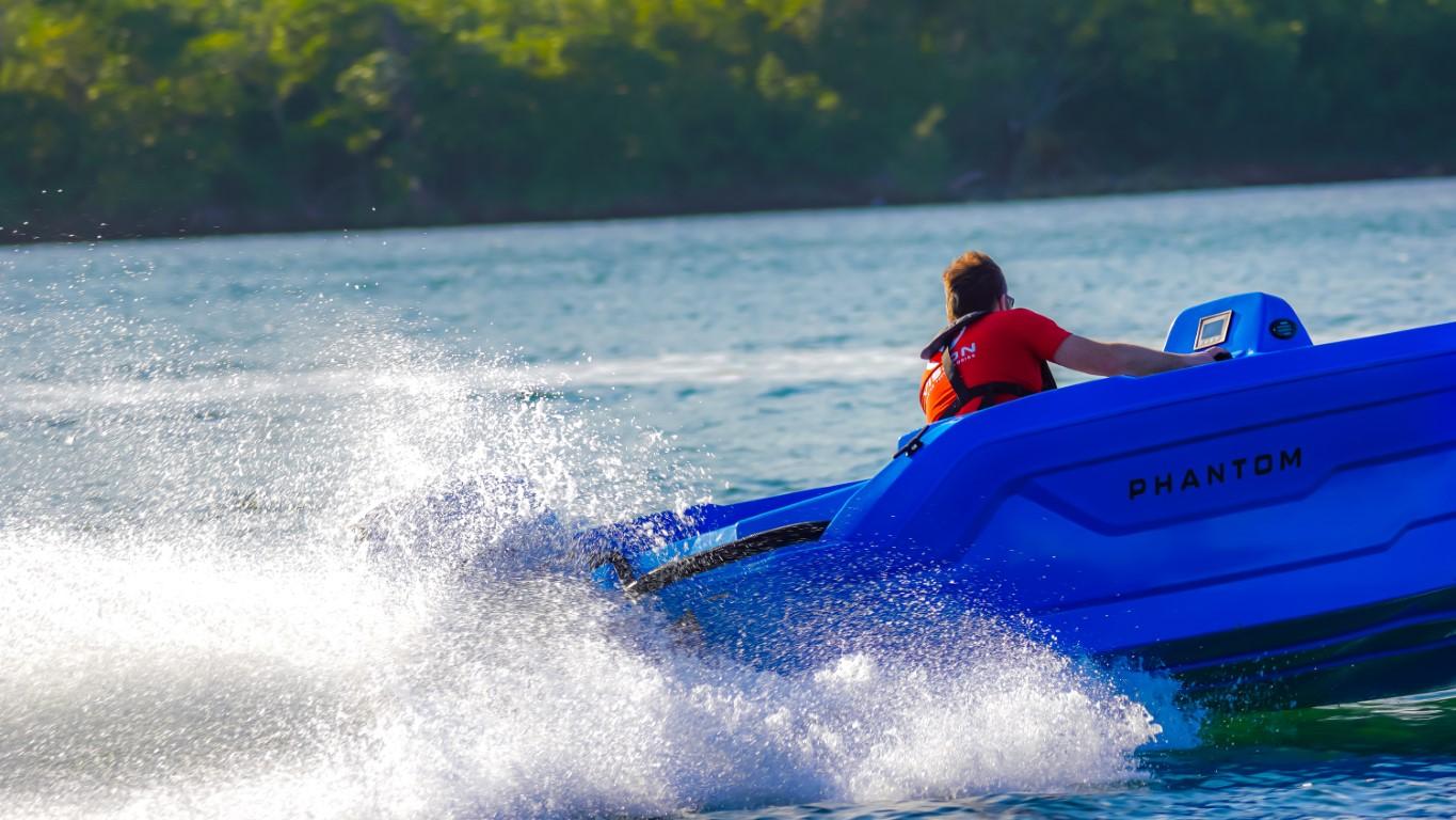 2024 Vision Marine Technologies Phantom boat speeding on water.
