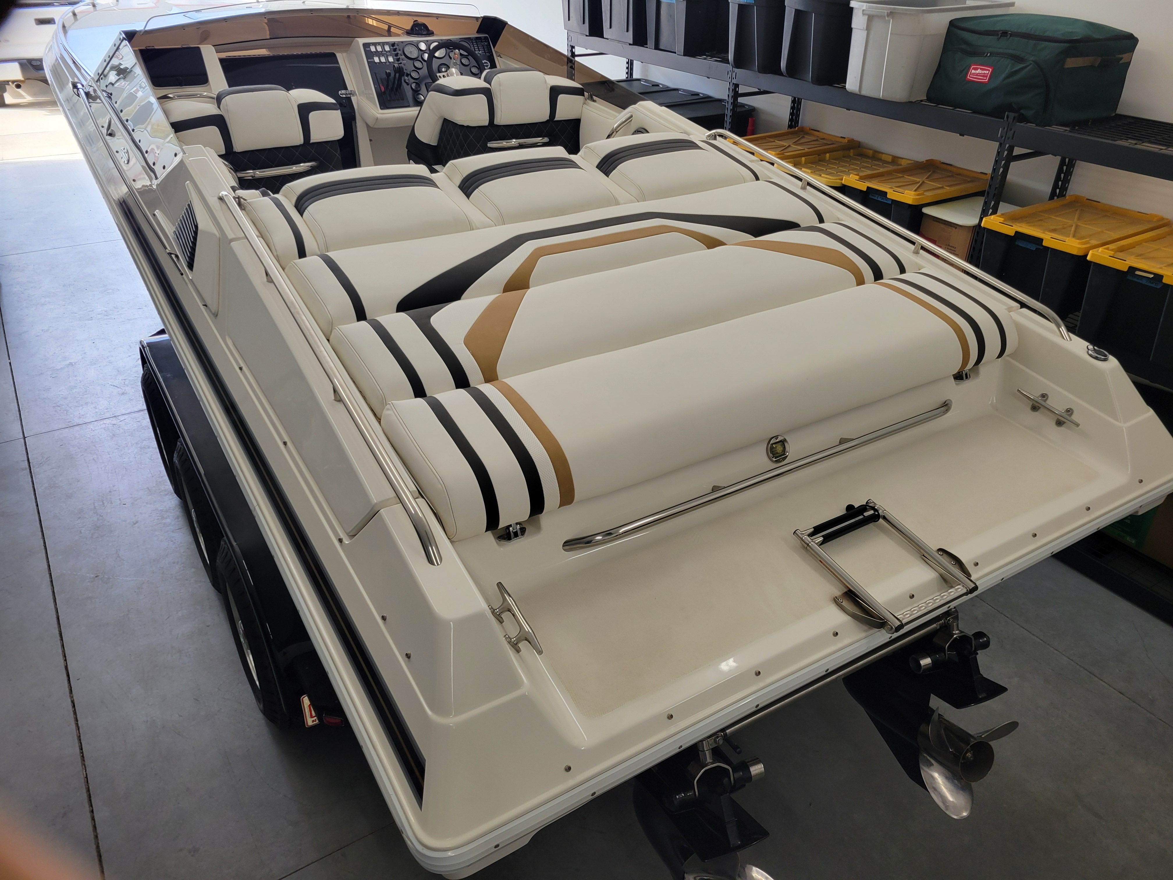 1992 Fountain Fever boat with striped upholstery in a garage setting.