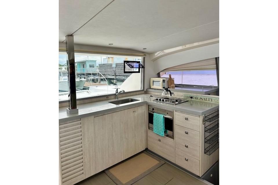 Modern kitchen interior of 2017 Leopard 40 yacht with sleek cabinetry and appliances.