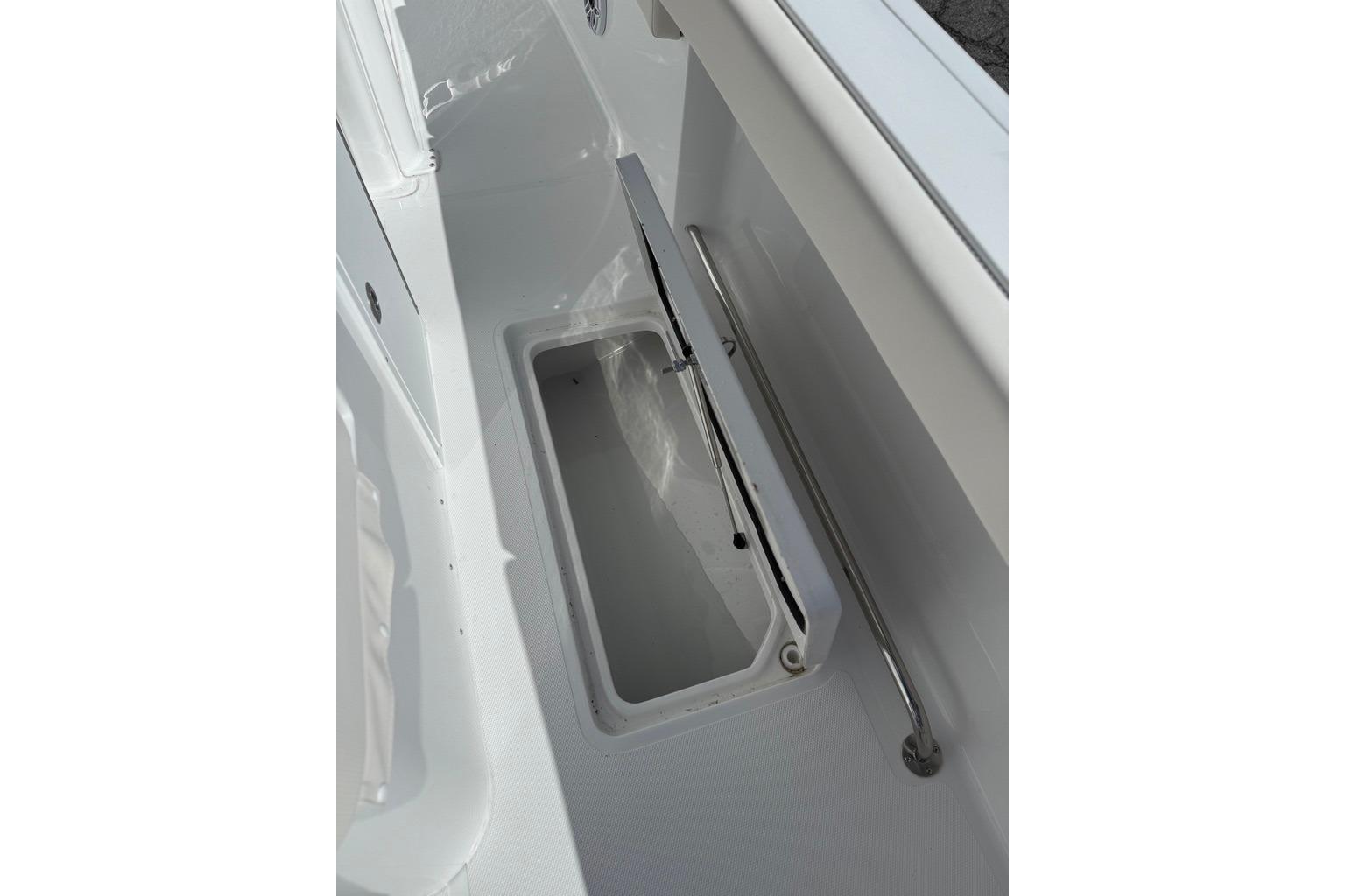 Open storage compartment on 2026 Sea Hunt Ultra 285 Coffin Box boat.