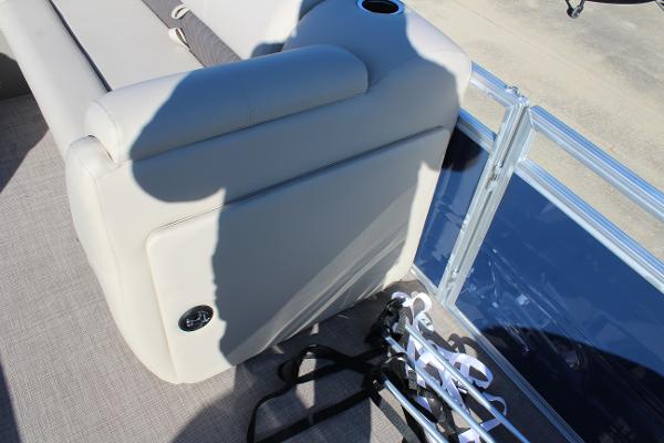 Sun Tracker Fishin' Barge 22 DLX 2025 interior with seating and cup holder.