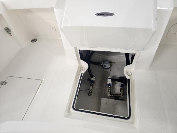 2025 Pathfinder 2400 Open boat interior compartment with visible wiring and components.
