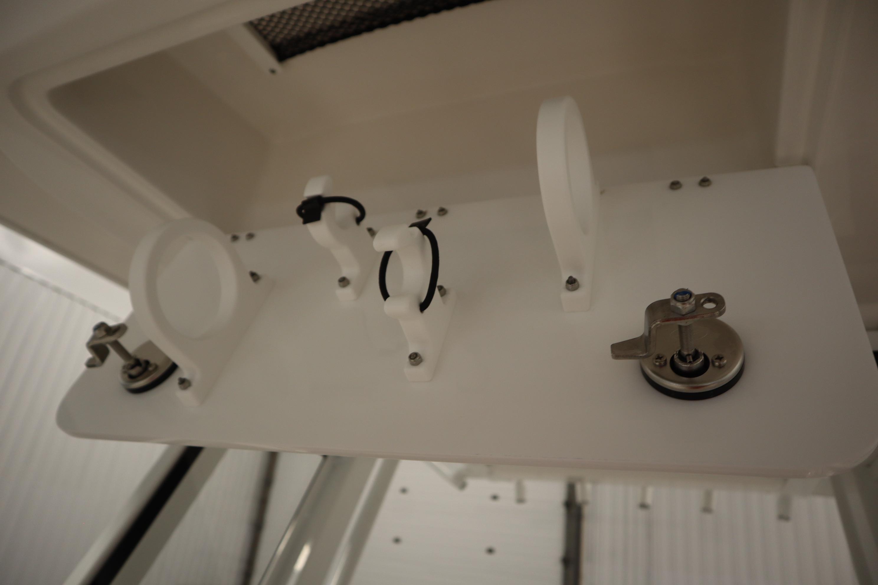 2026 Sea Fox 228 Commander boat interior detail with white fittings and metal latch.