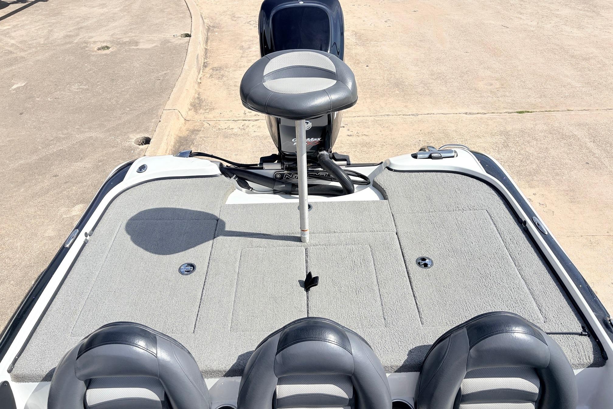 2011 Nitro Z-7 boat with cushioned seating and carpeted deck.