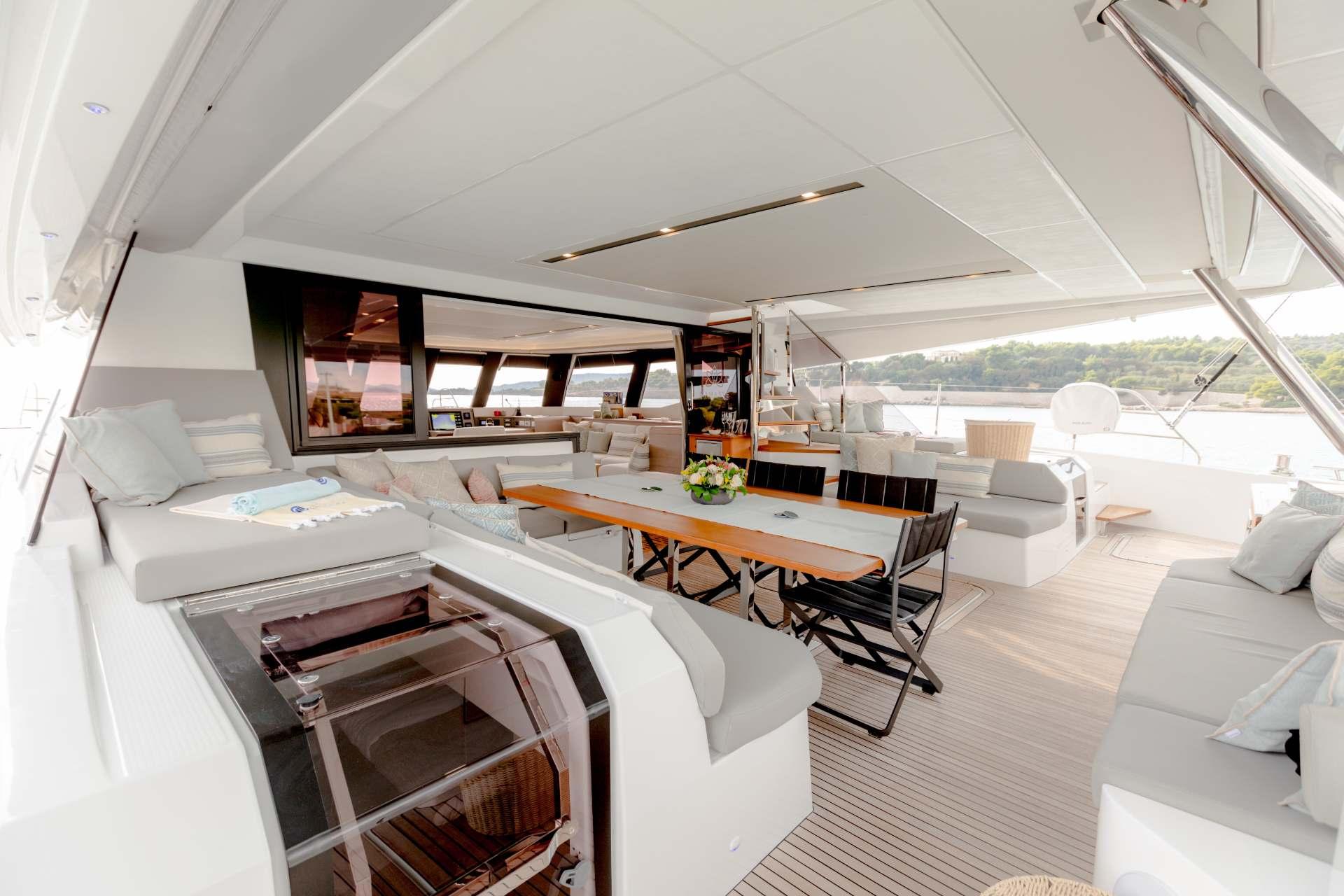 Luxurious 2025 Fountaine Pajot Samana 59 yacht interior with spacious seating and elegant design.