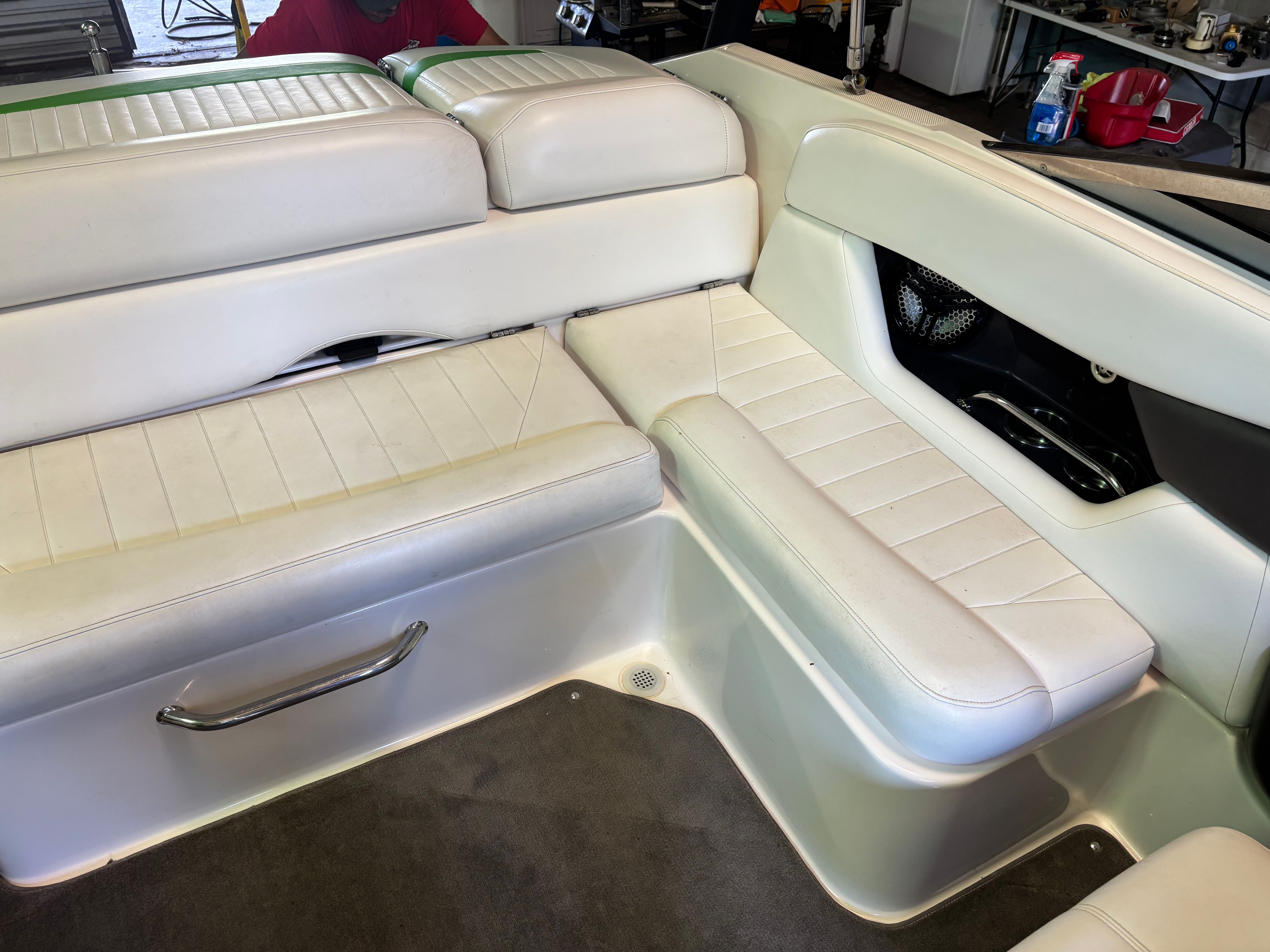 Interior of a 2006 Regal 2200 Bowrider with white upholstered seating.