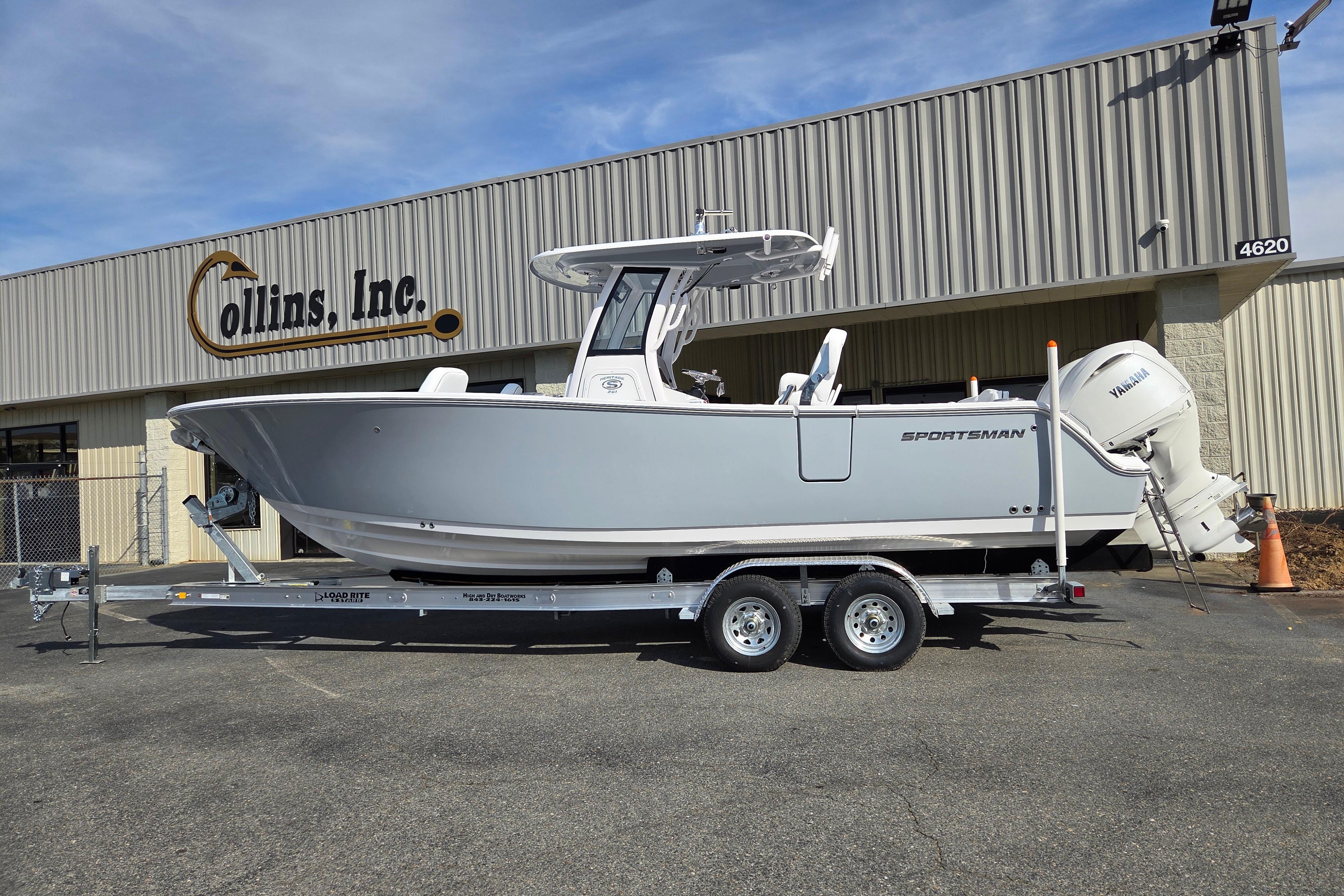 2026 Sportsman Heritage 261 Center Console boat on trailer outside Collins Inc. building.
