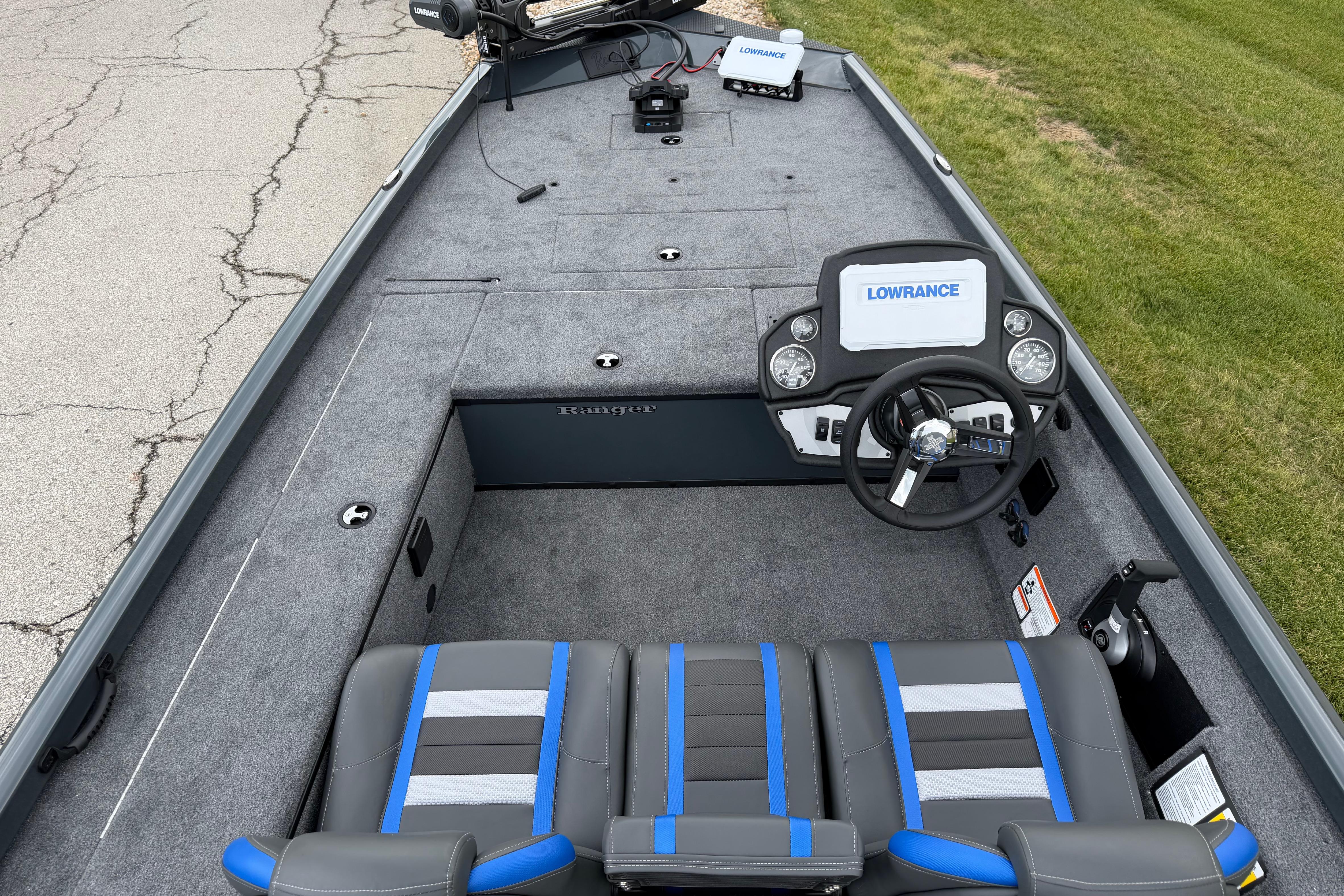 2026 Ranger RT178C boat interior with steering wheel, Lowrance display, and cushioned seats.