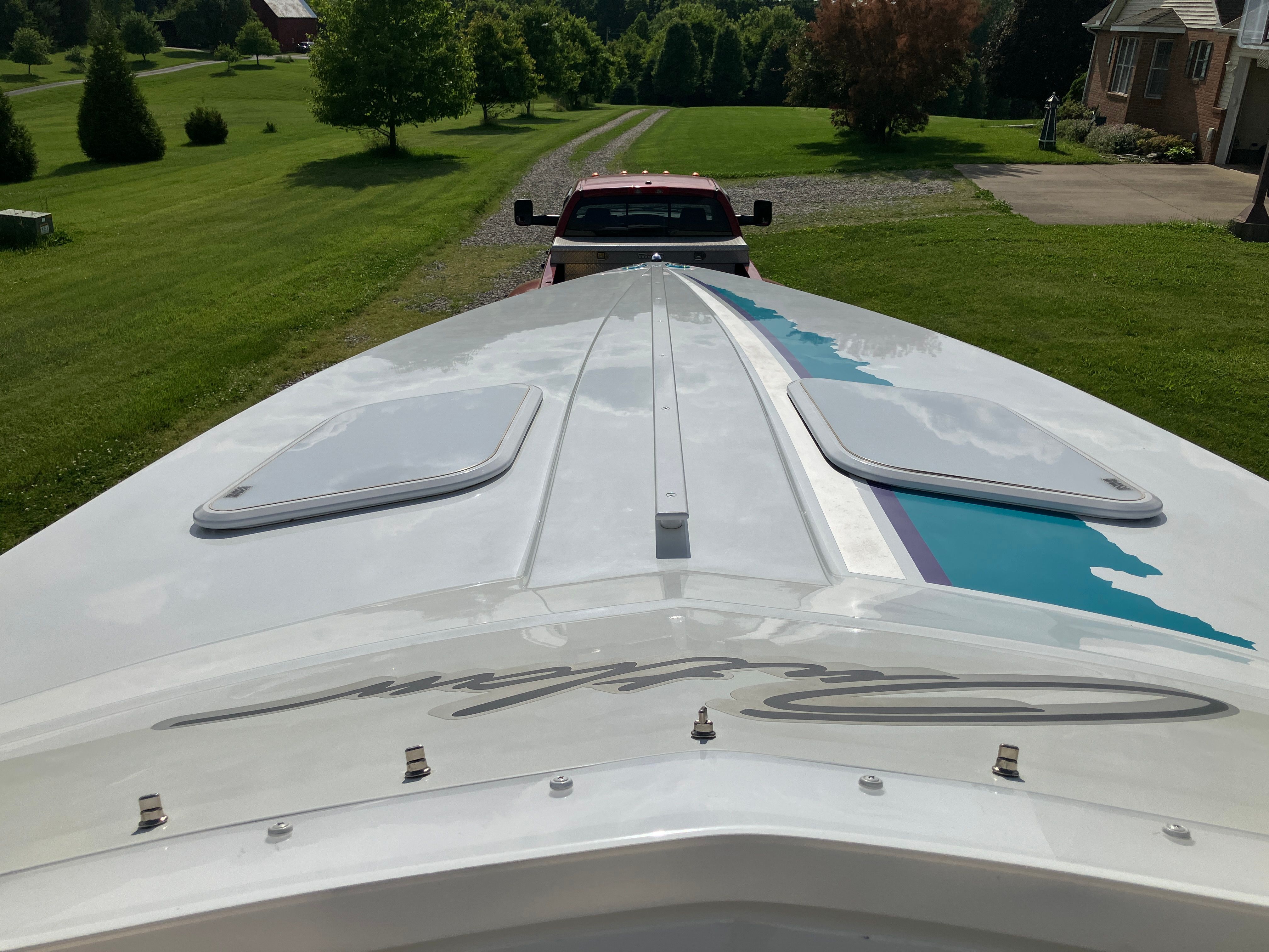 Baja 36 Outlaw 2000 on trailer in garden.