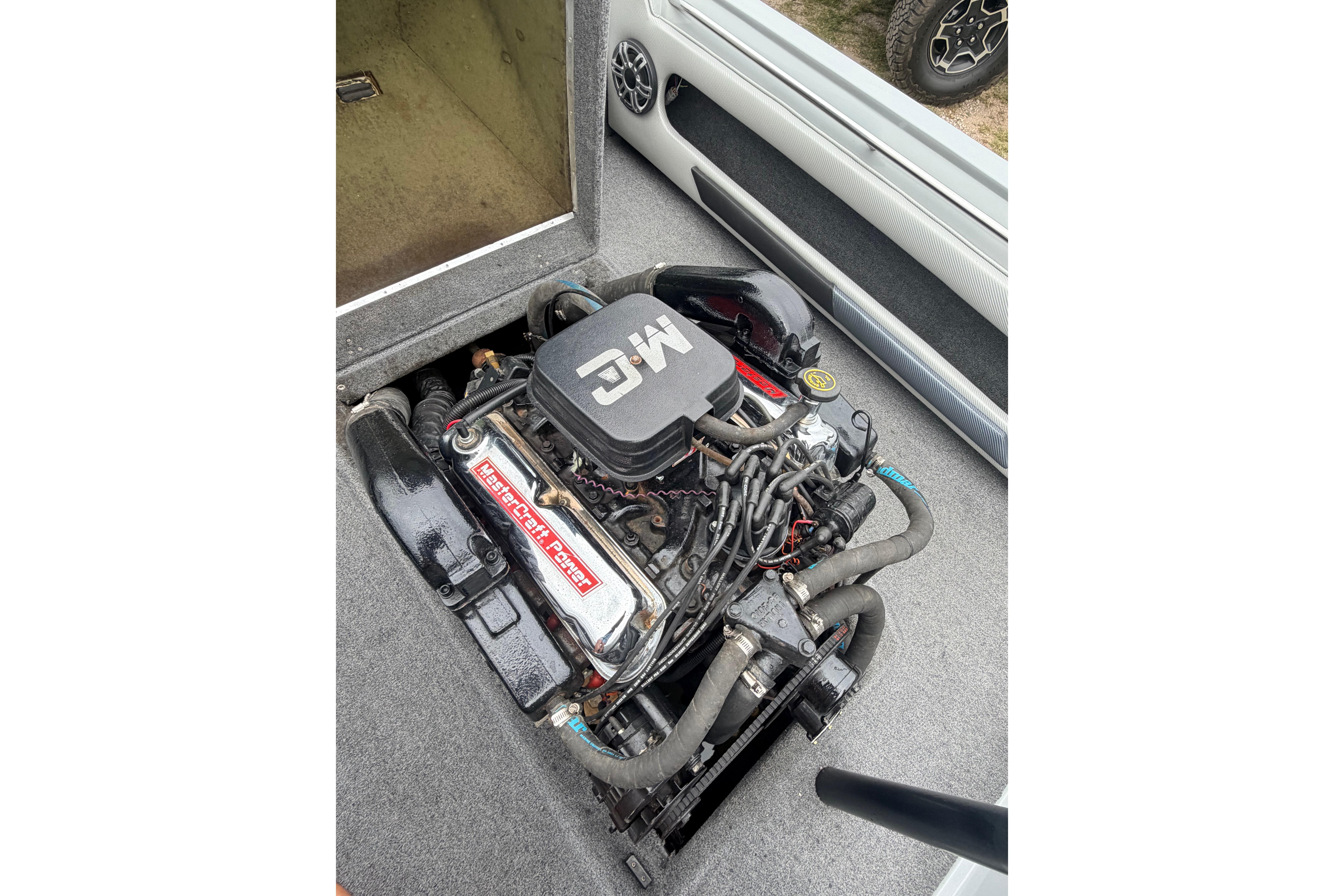 1989 MasterCraft ProStar 190 engine compartment, showcasing a well-maintained inboard motor.