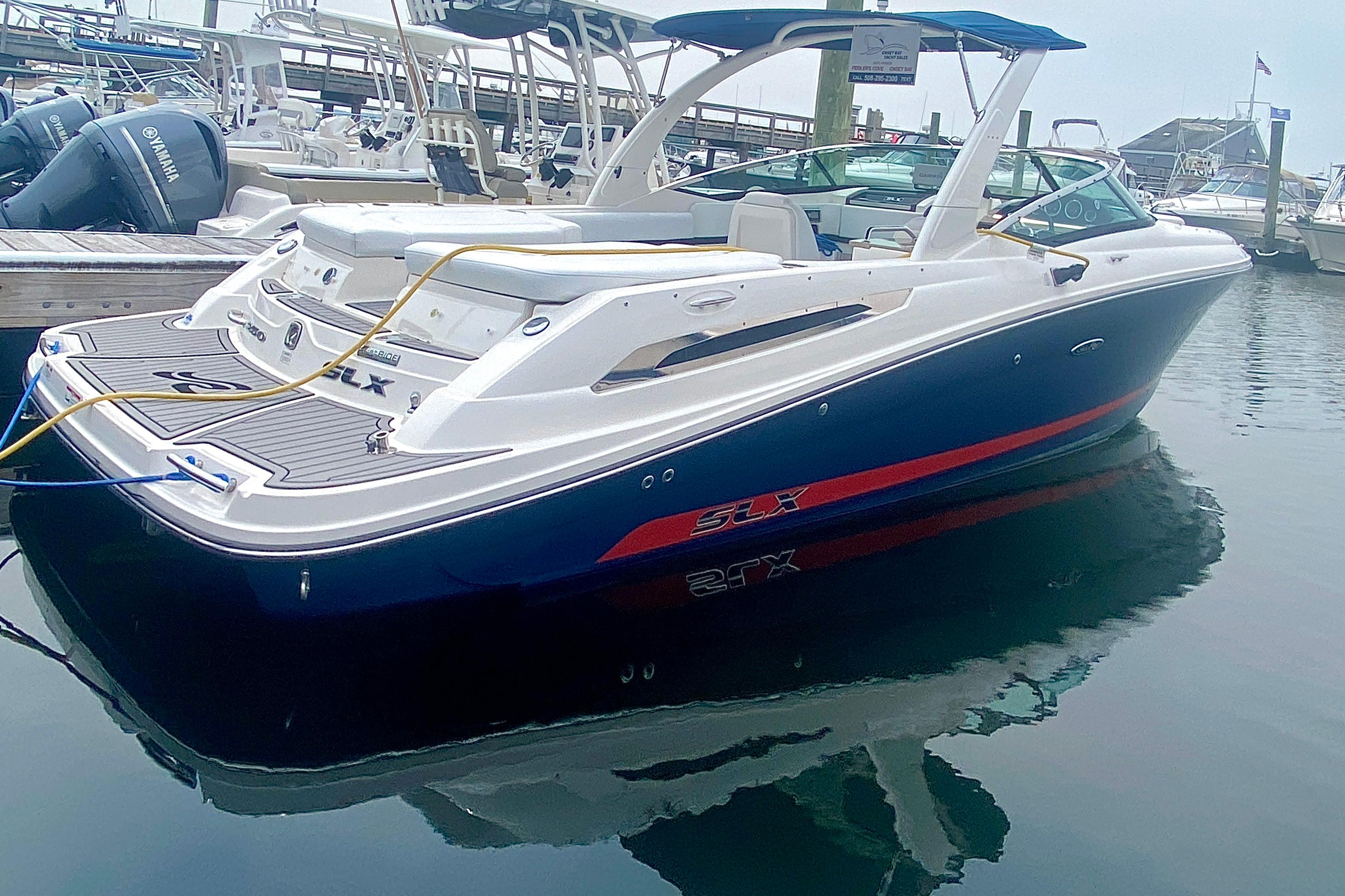 2015 Sea Ray 250 SLX boat docked in marina, featuring sleek design and modern amenities.