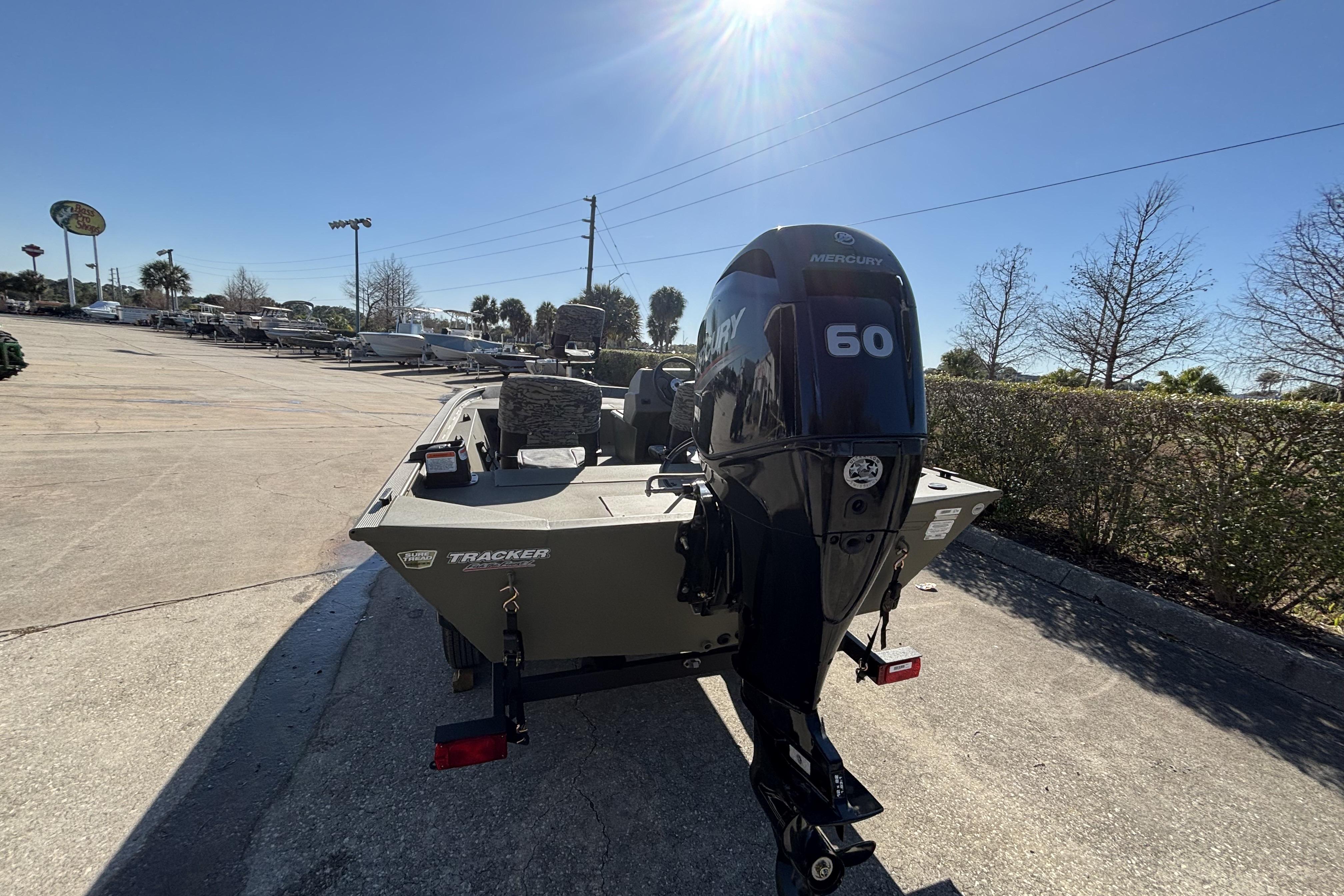 2026 Tracker Grizzly 1754 SC boat with Mercury 60 engine in outdoor setting.