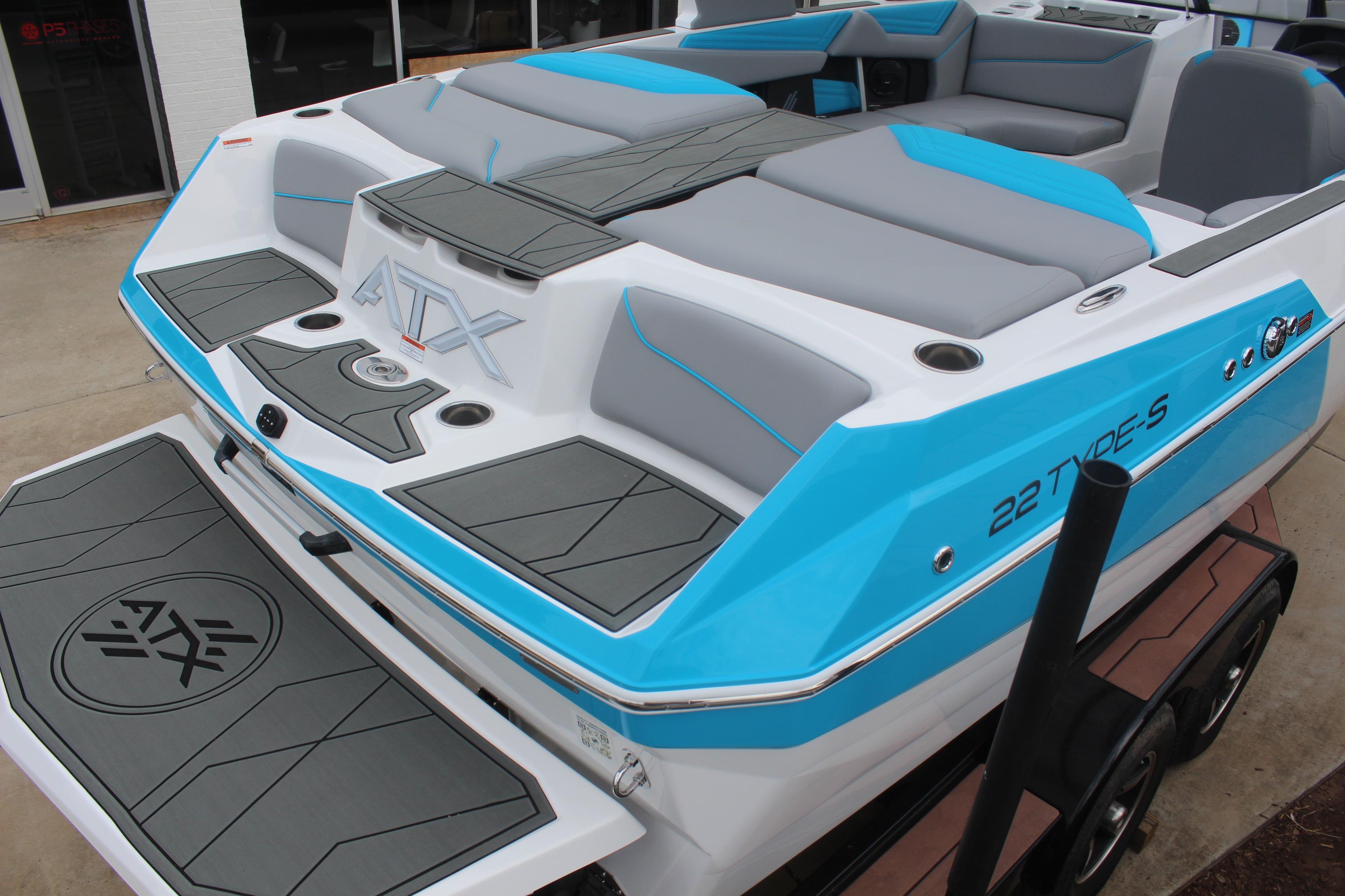 2026 ATX Surf Boats 22 Type-S with sleek blue and gray design, rear view.