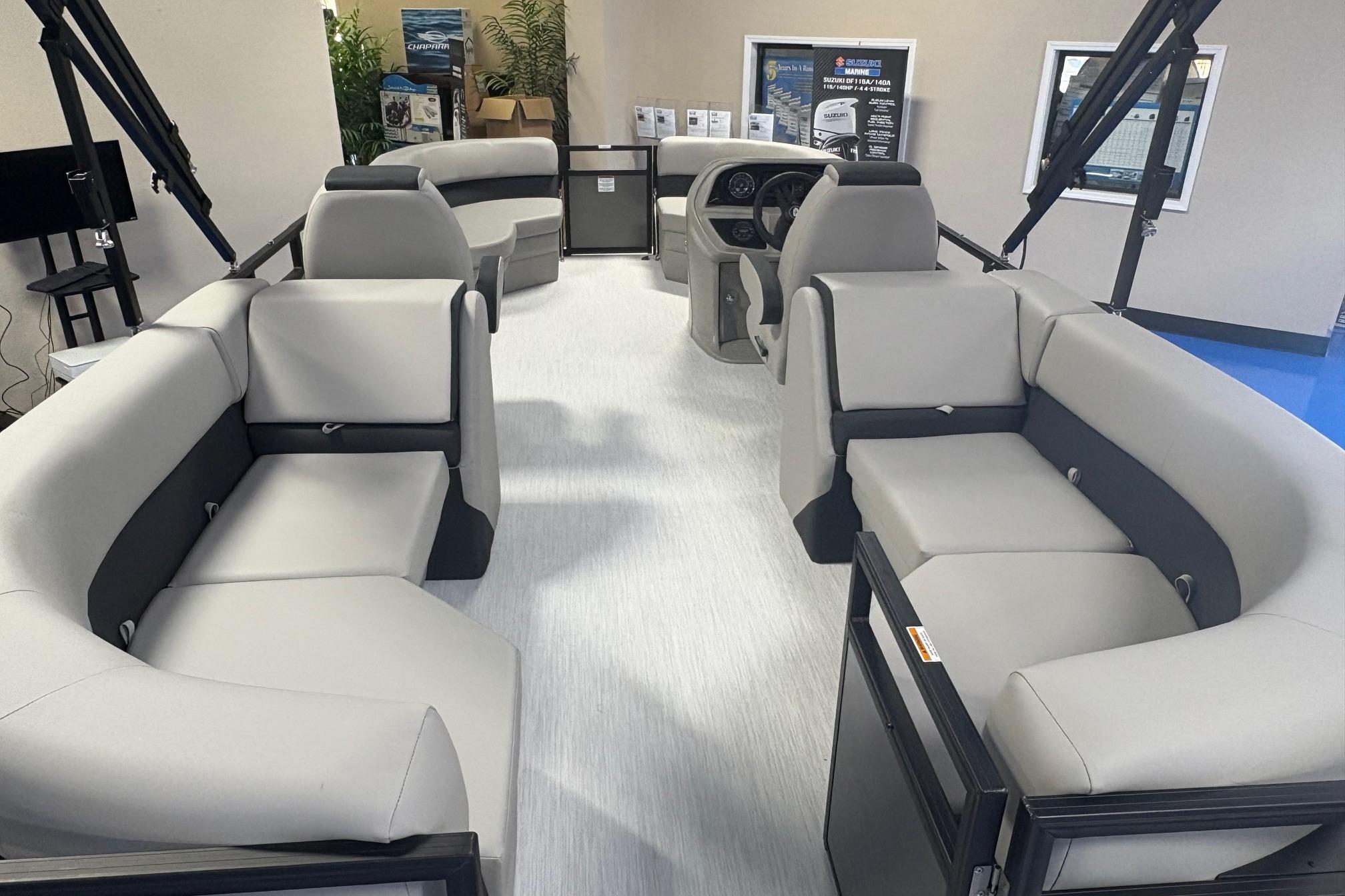 Interior view of 2026 Dockside 22DQ boat with modern seating and steering console.