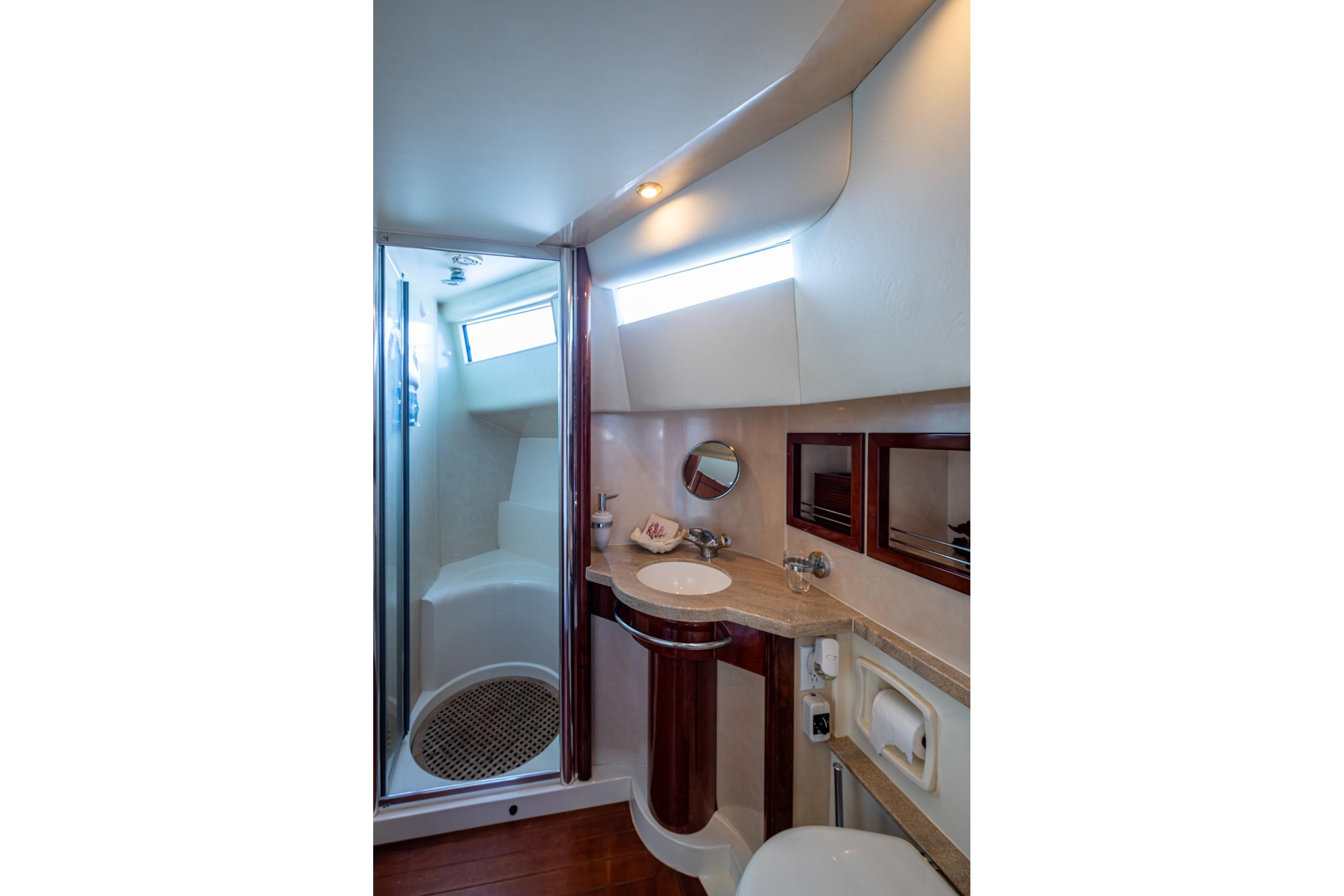 Luxurious bathroom in 2000 Fairline Squadron 52 yacht, featuring modern fixtures and elegant design.
