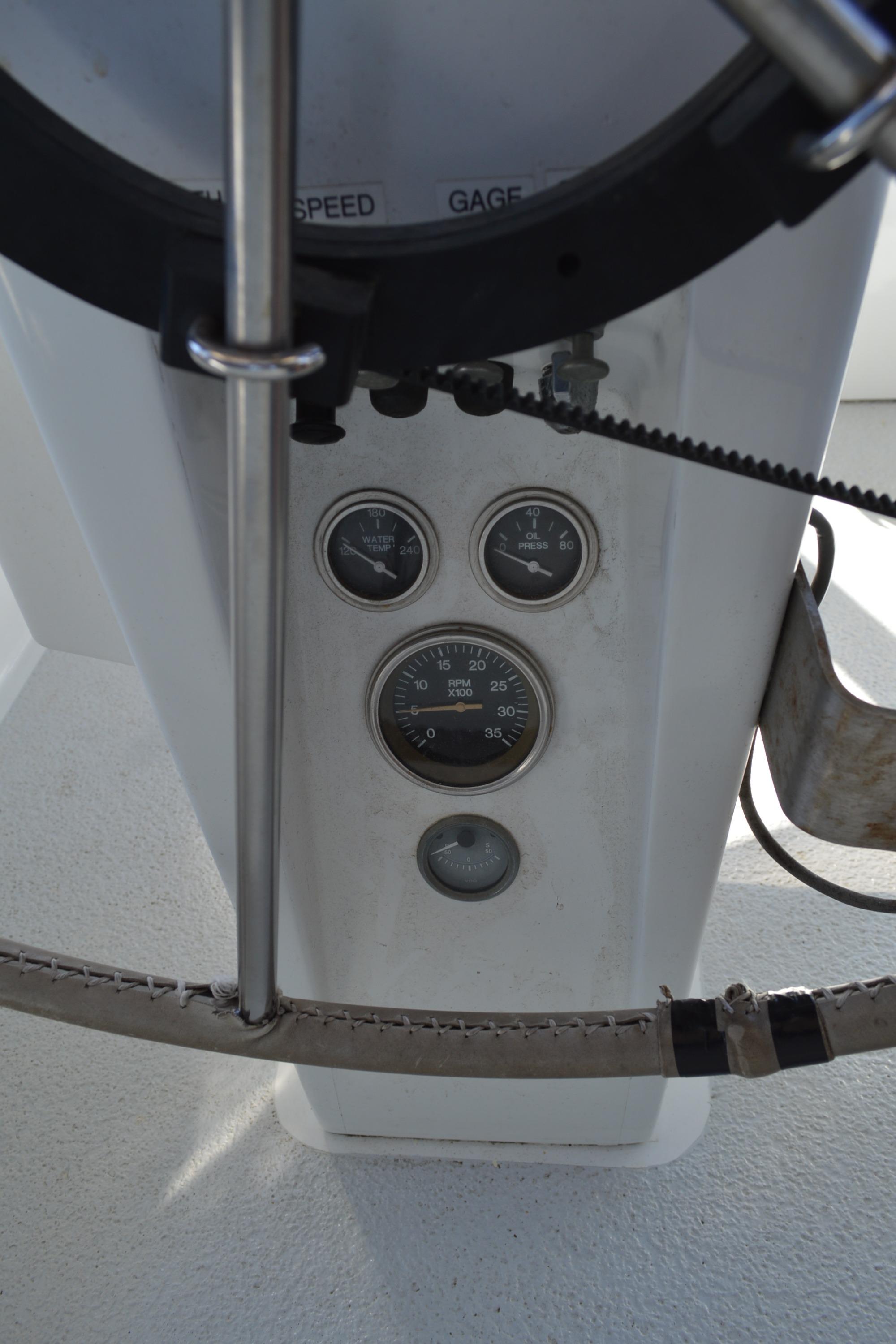 1979 Morgan 461 yacht dashboard with gauges and steering wheel.
