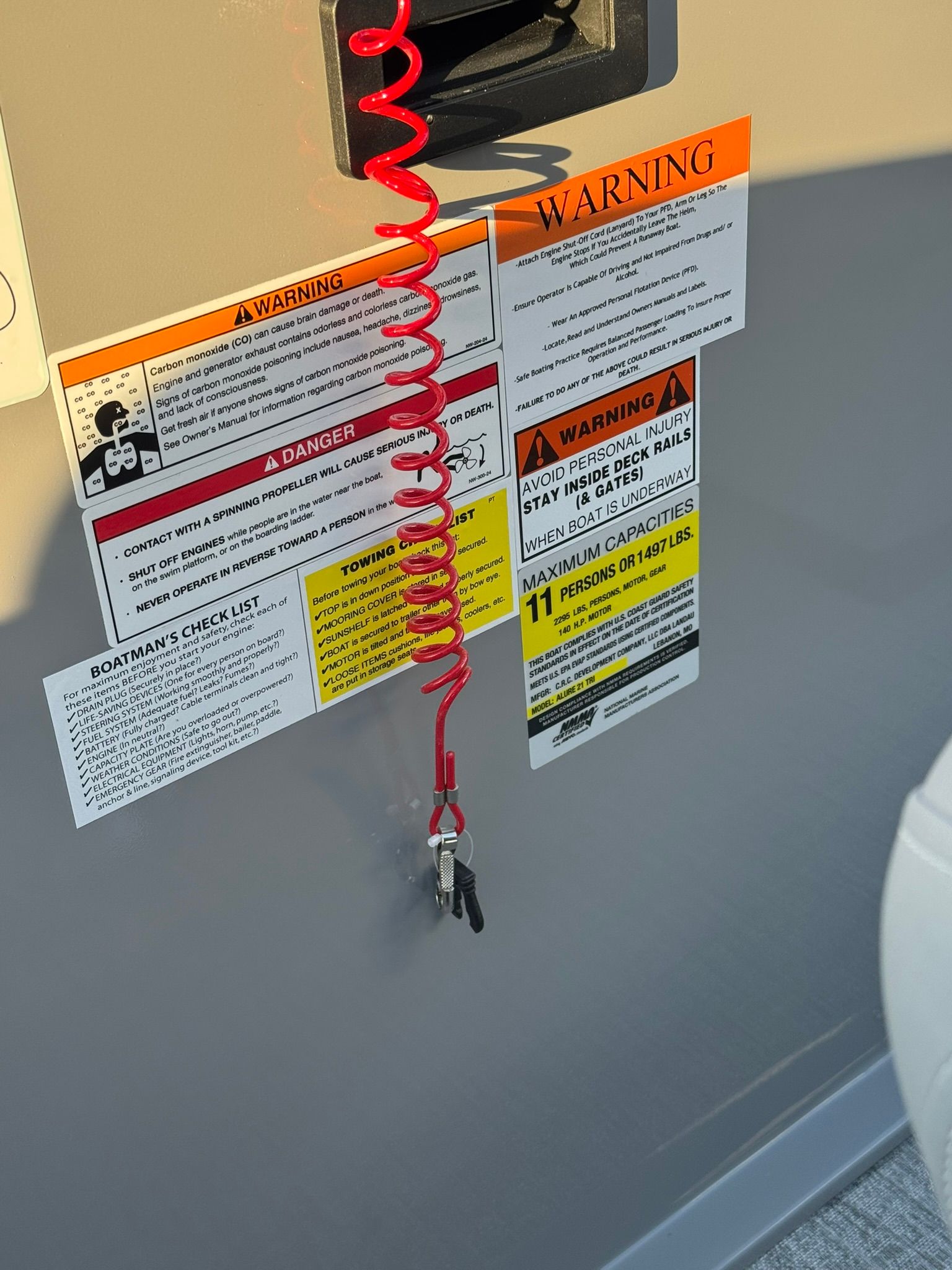 Warning labels and safety information on a 2026 Landau Alure 21CC Fish.