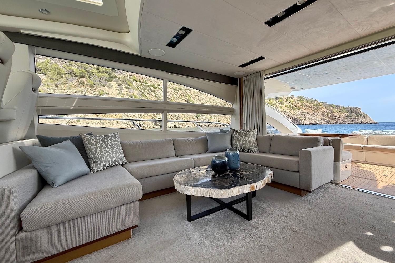 Luxurious interior of 2015 Princess V72 yacht with scenic ocean view.