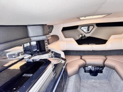 Interior of a 1992 Fountain Fever boat, featuring plush seating and modern amenities.