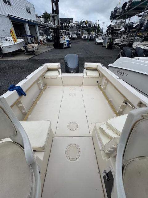 1992 Grady-White Explorer 244 boat interior at a marina, showcasing spacious deck layout.