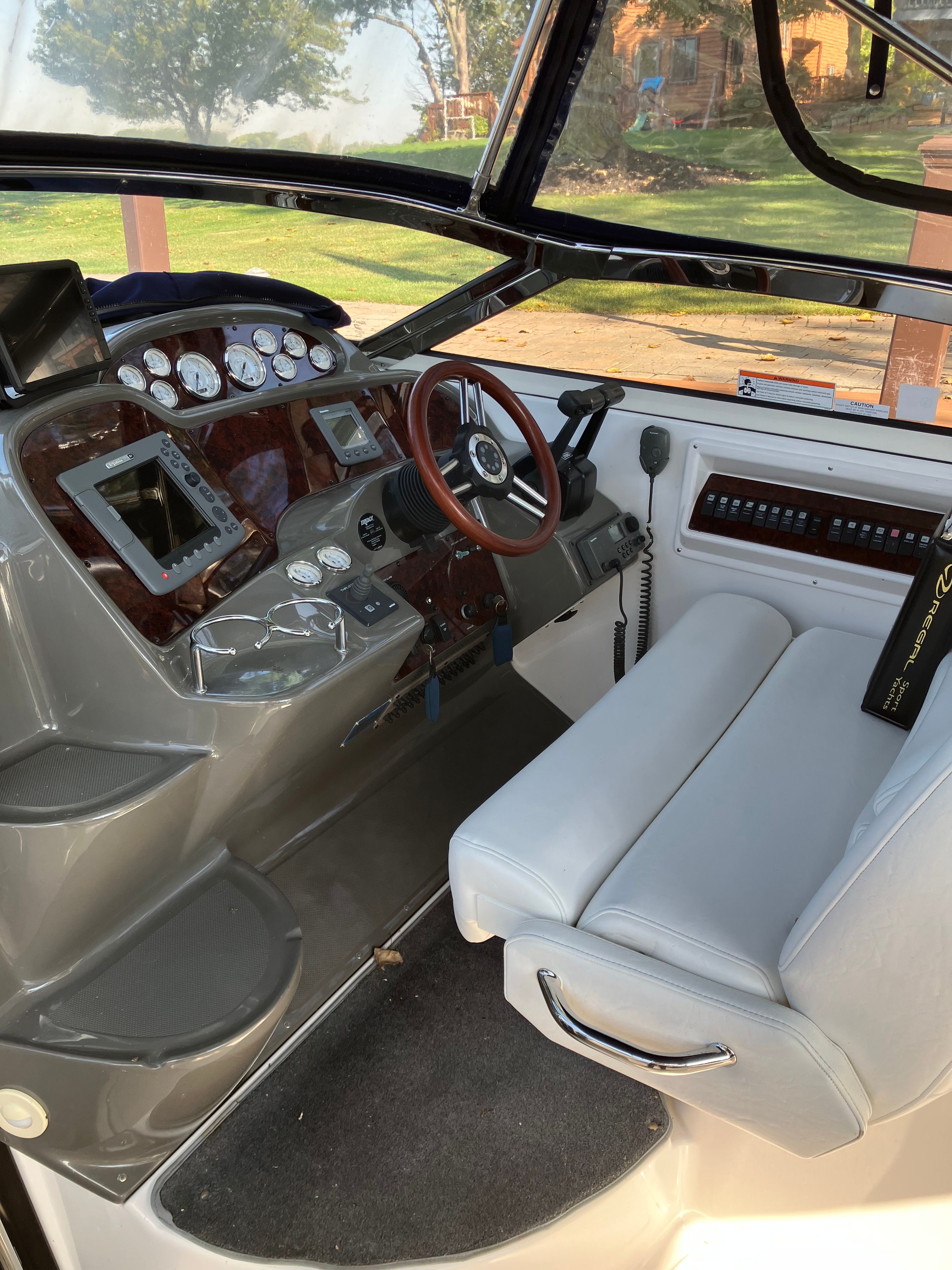 Interior of a 2008 Custom Commodore boat with steering console.