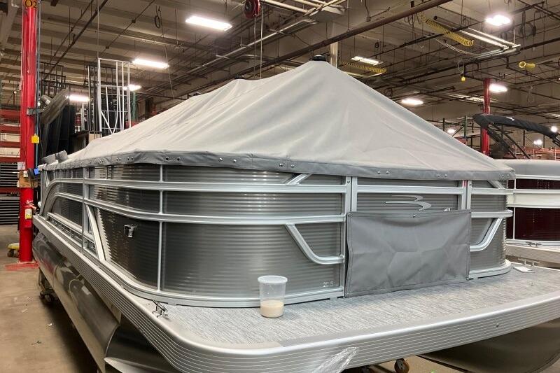 2026 Bennington 20 S-One Fish pontoon boat covered in a warehouse setting.