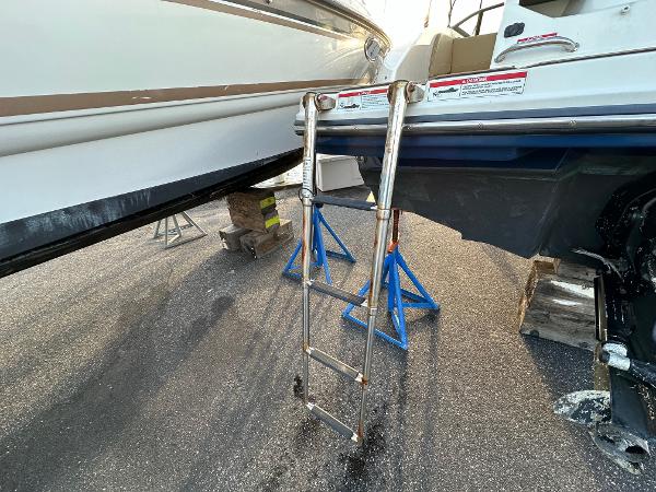 Sea Ray SPX 190 boat with ladder on stands, year 2021.