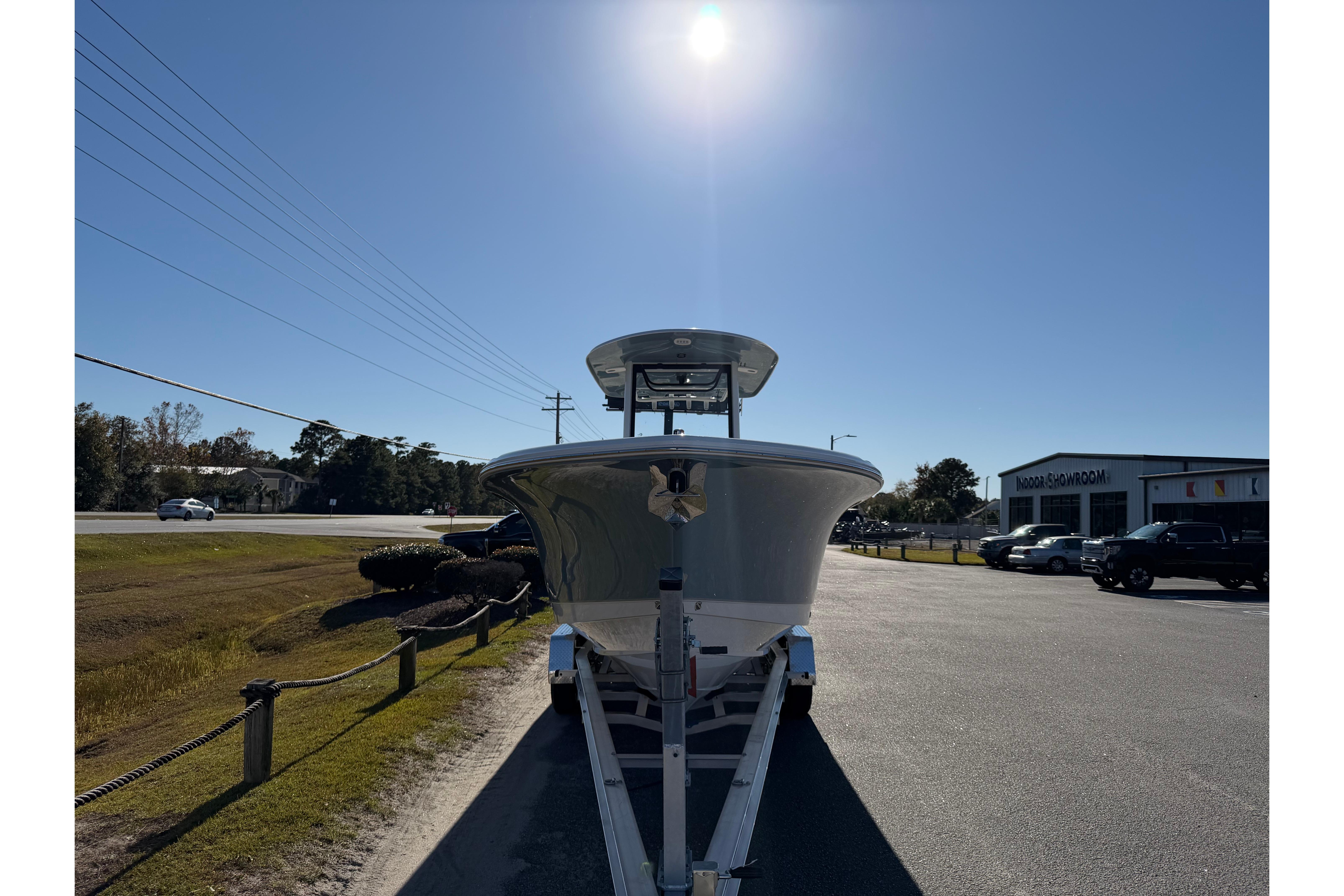 2026 Sea Hunt Ultra 275 Coffin Box boat on trailer under bright sun.