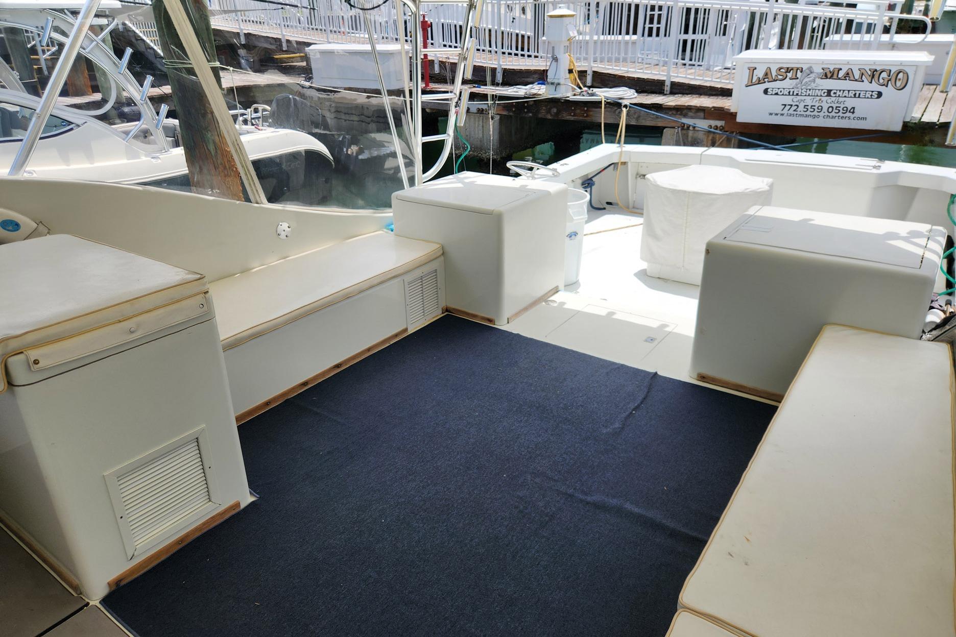 1987 Young Brothers Custom Sport Fish boat interior with seating and fishing equipment.