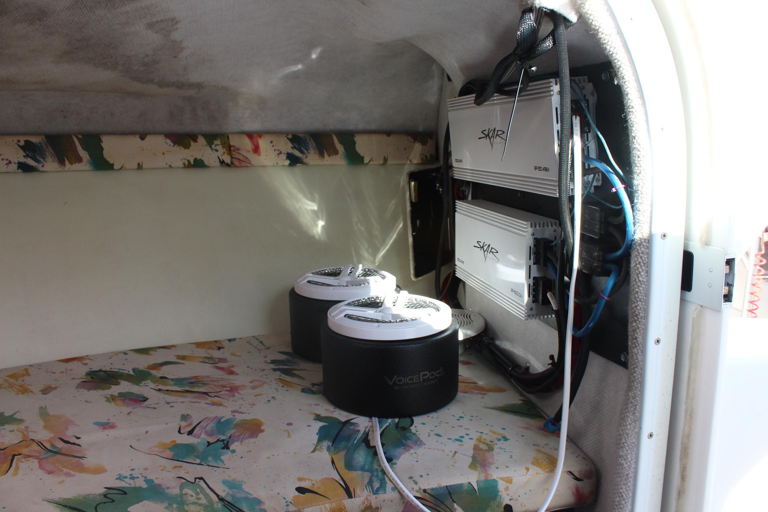 Interior of a 1996 Baja 232 boat with Skar audio equipment installed.