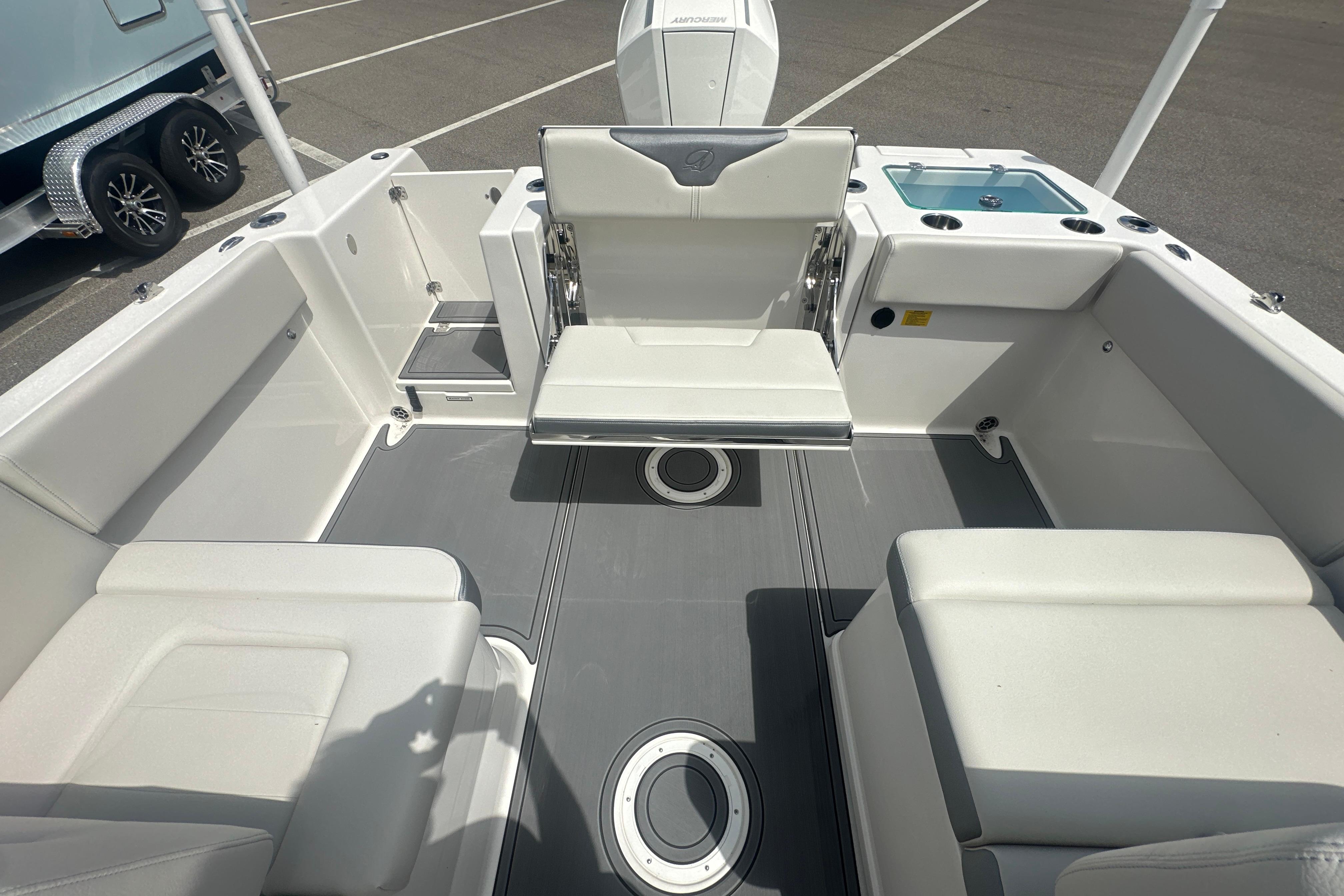 2026 Sailfish 226 DC boat interior with seating and storage compartments.