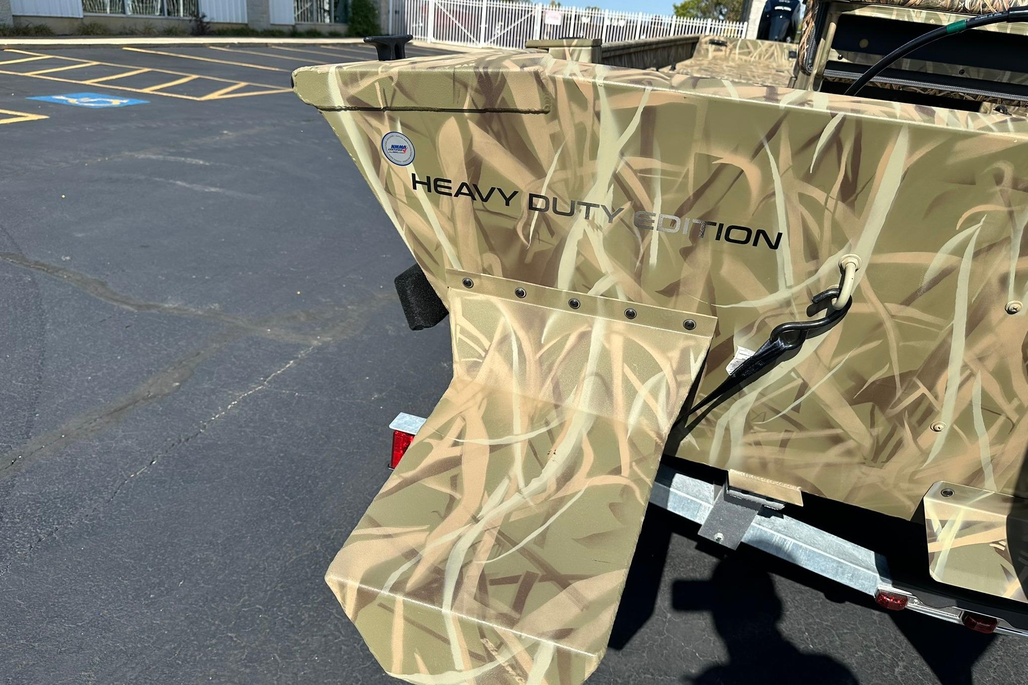 2026 Lowe Roughneck 2070CC Heavy Duty Edition boat with camouflage design.