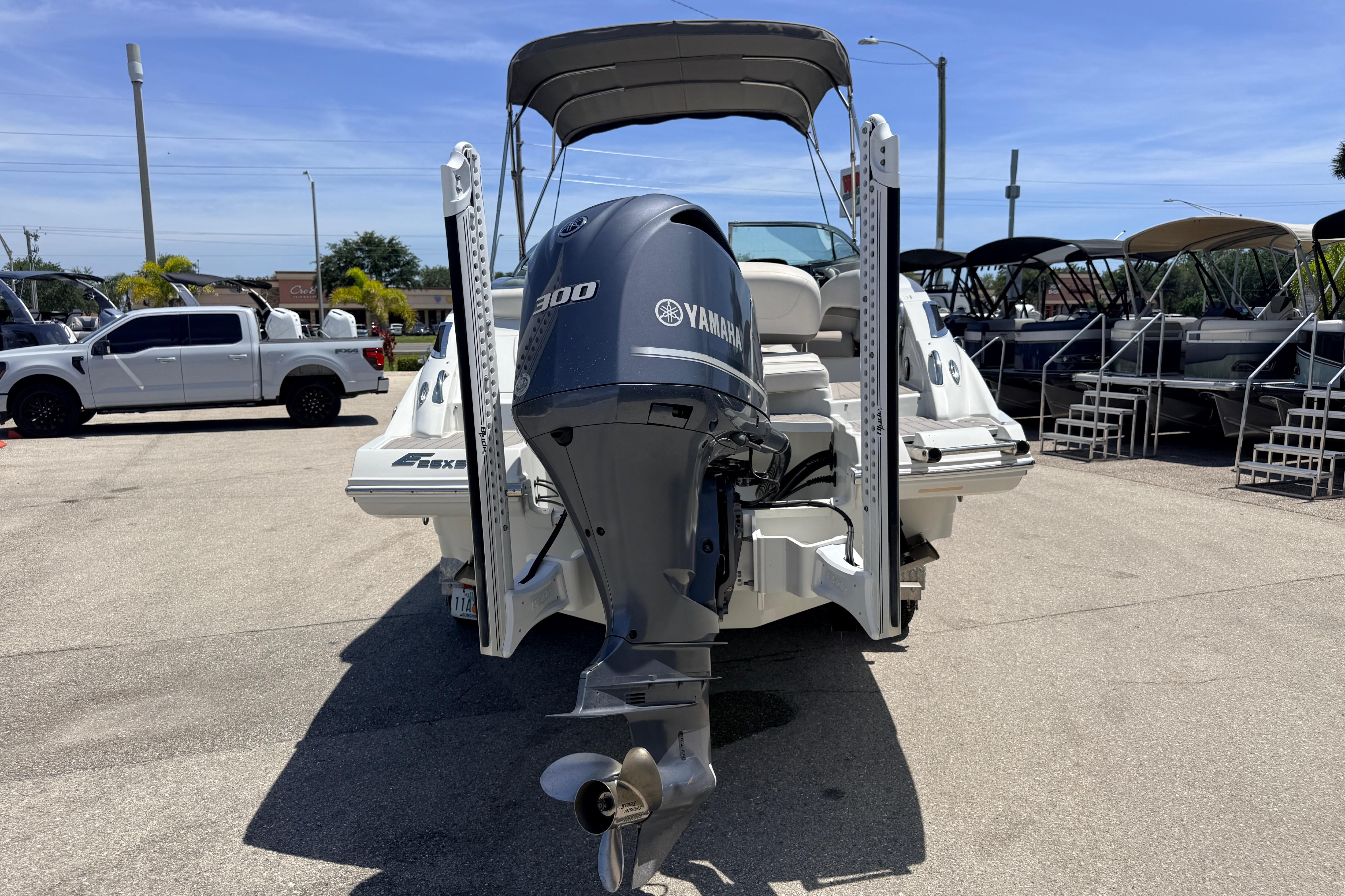 2018 Crownline Eclipse E26 XS boat with Yamaha 300 outboard motor in a marina.