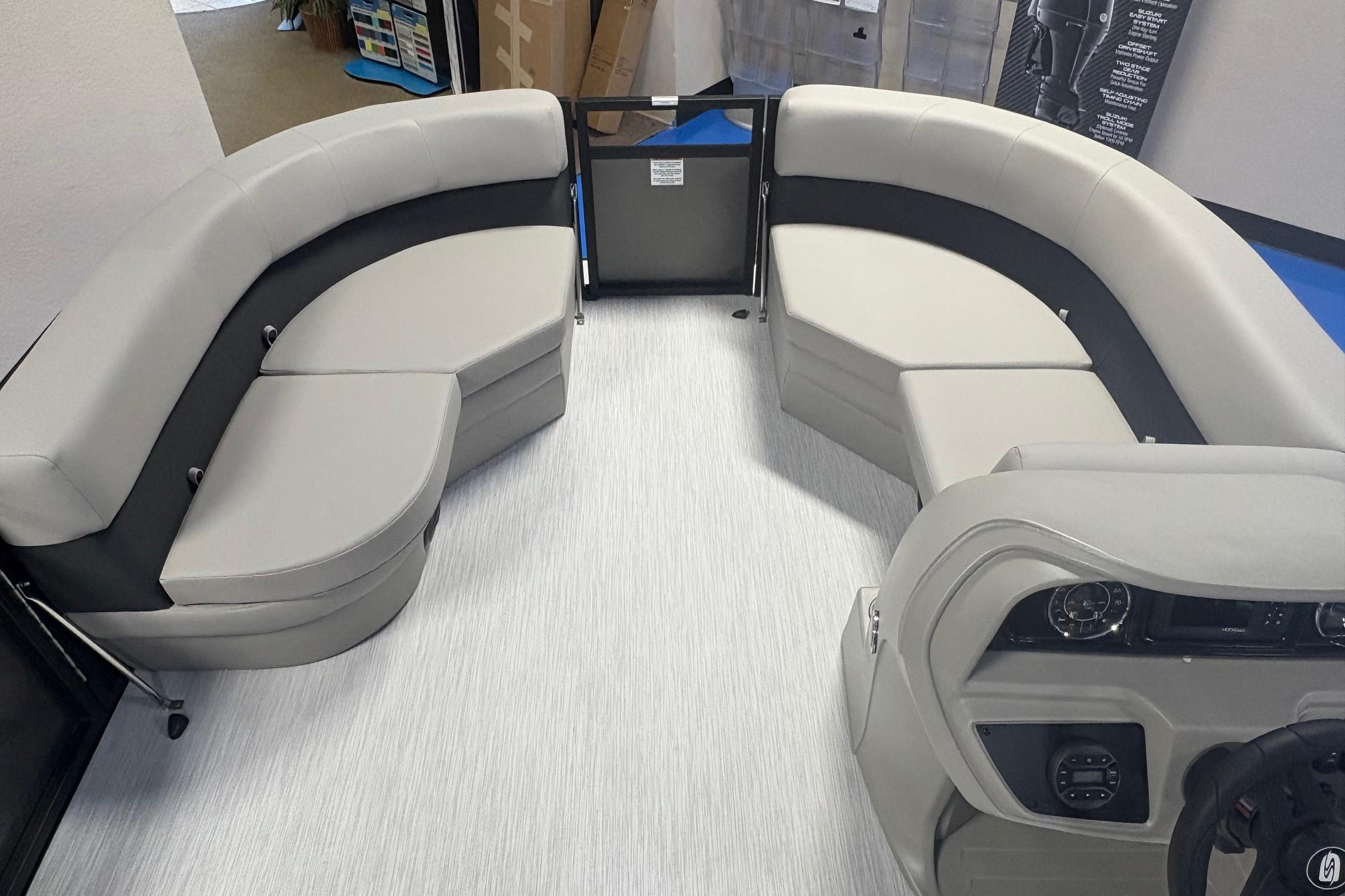 Interior of 2026 Dockside 22DQ boat with modern seating and control panel.