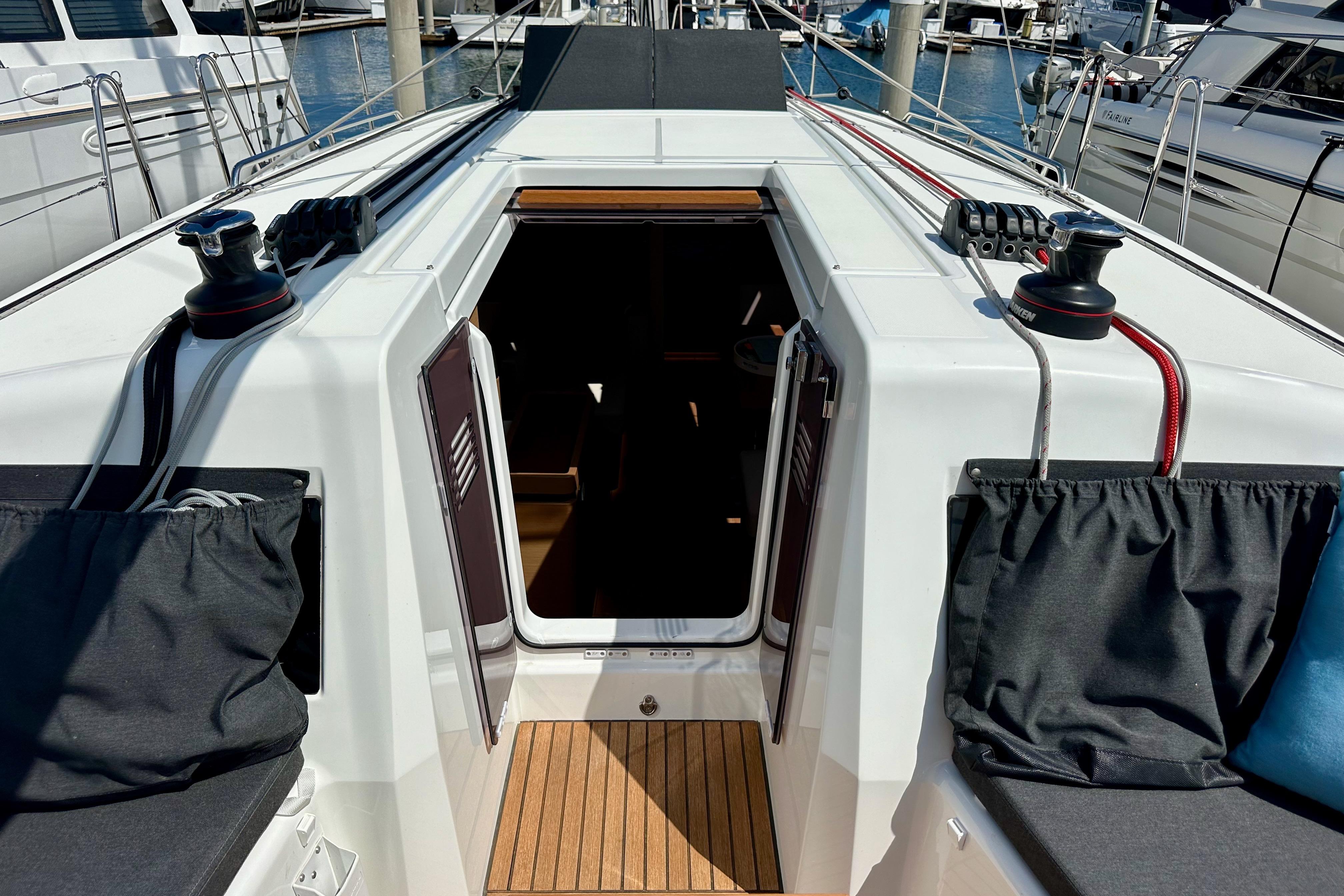 2024 Jeanneau Sun Odyssey 410 yacht cockpit with open companionway and winches.