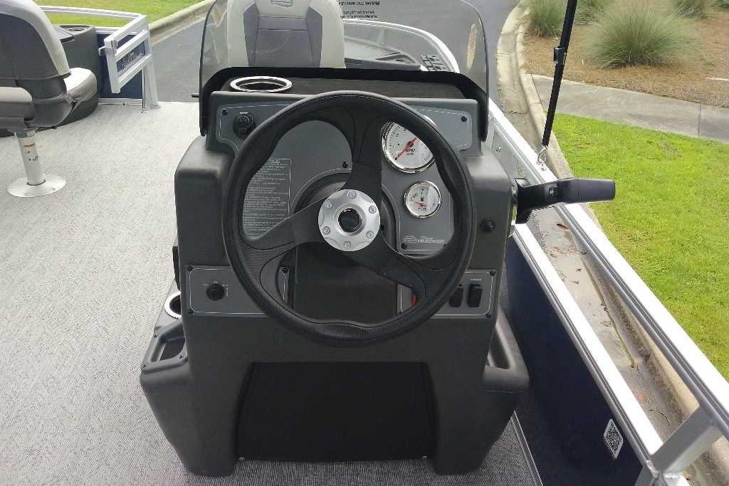 2026 Sun Tracker Bass Buggy 18 DLX steering console with gauges and controls.
