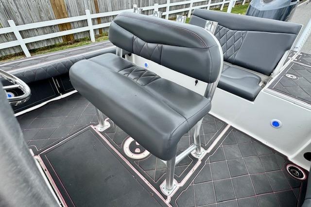 2015 Robalo 226 Cayman boat interior with black cushioned seating and sleek design.