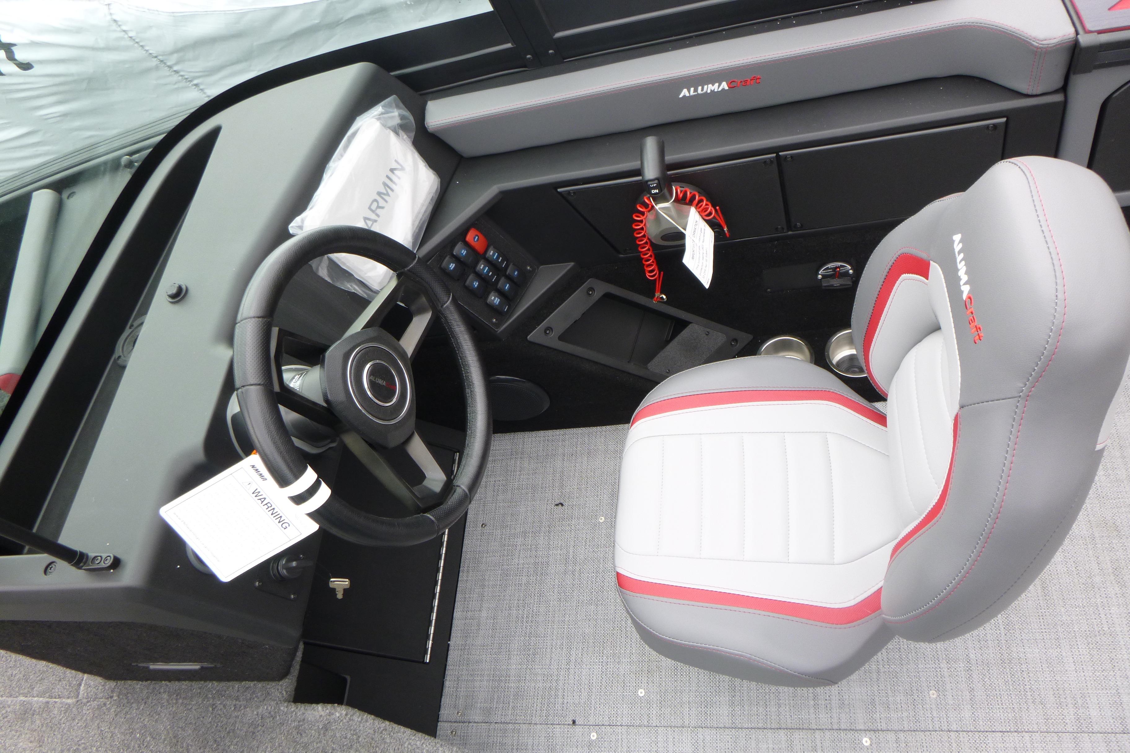 2025 Alumacraft Trophy 185X Sport boat interior with steering wheel and captain's seat.