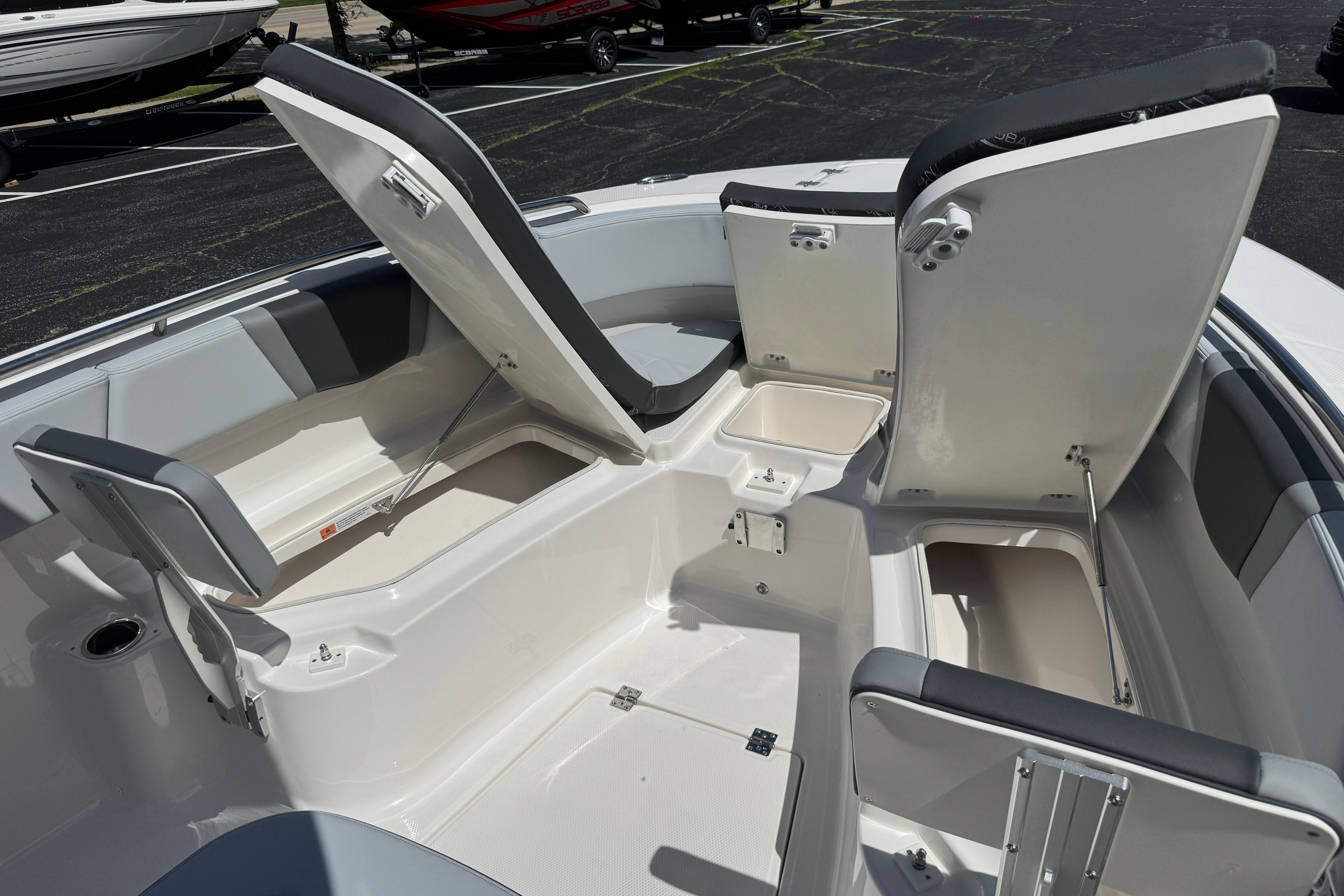 2026 Robalo R250 Center Console boat interior with open storage compartments.
