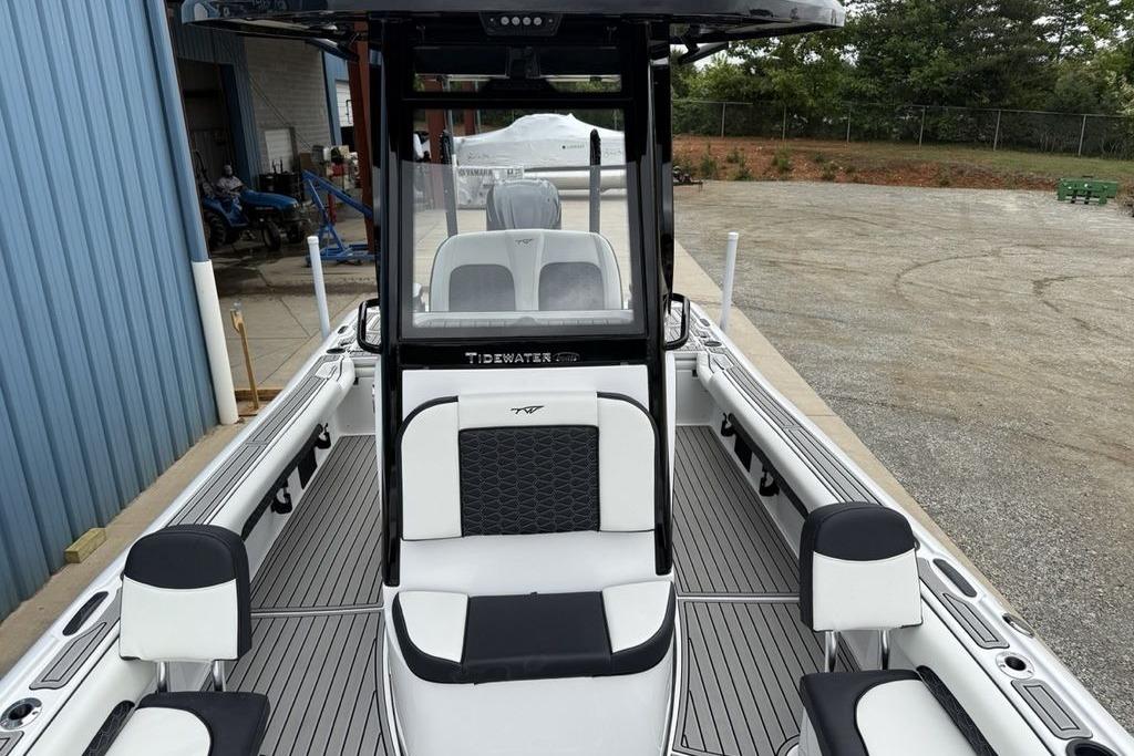 2026 Tidewater 2500 Carolina Bay boat interior with seating and console, docked outdoors.