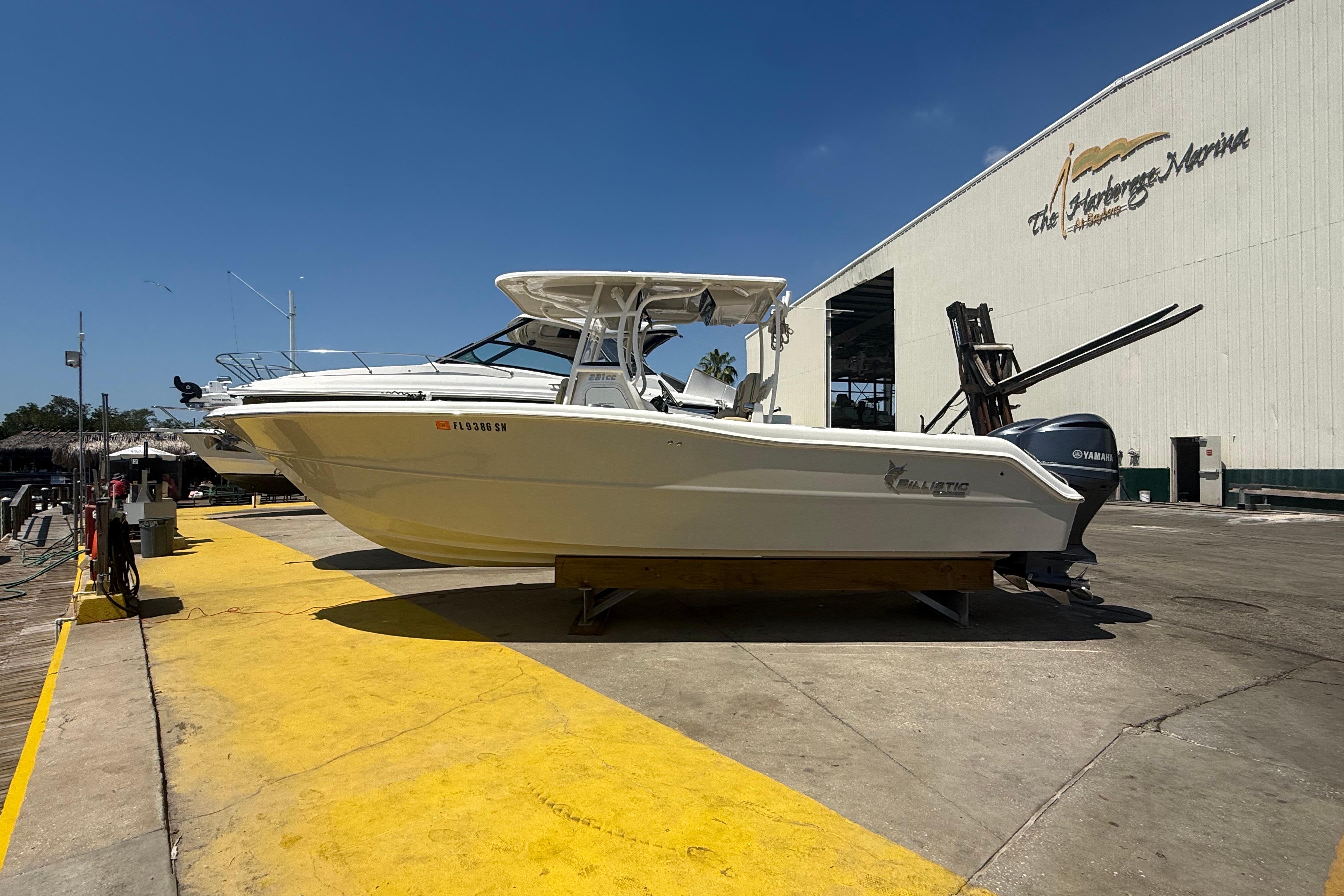 2019 Key West Billistic 281 Center Console boat at marina dockside.