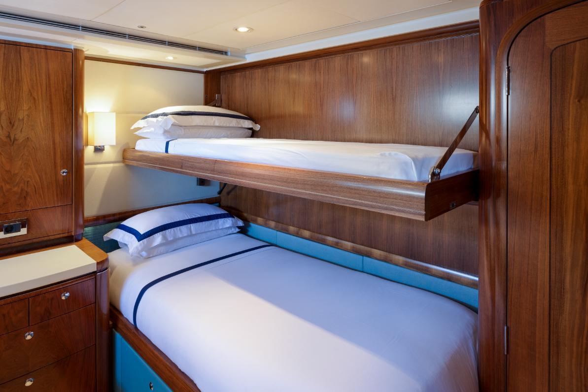 Luxurious cabin with bunk beds on 2005 Royal Huisman Ketch Sailing Yacht.
